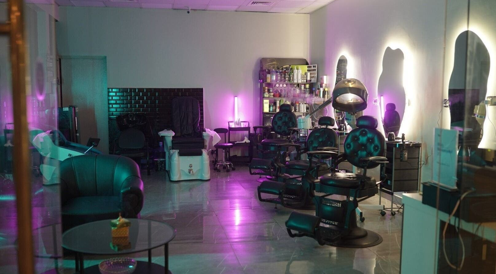 Luxurious interior of Glowing Gents Salon and SPA with modern chairs and ambient lighting, Dubai, AE.
