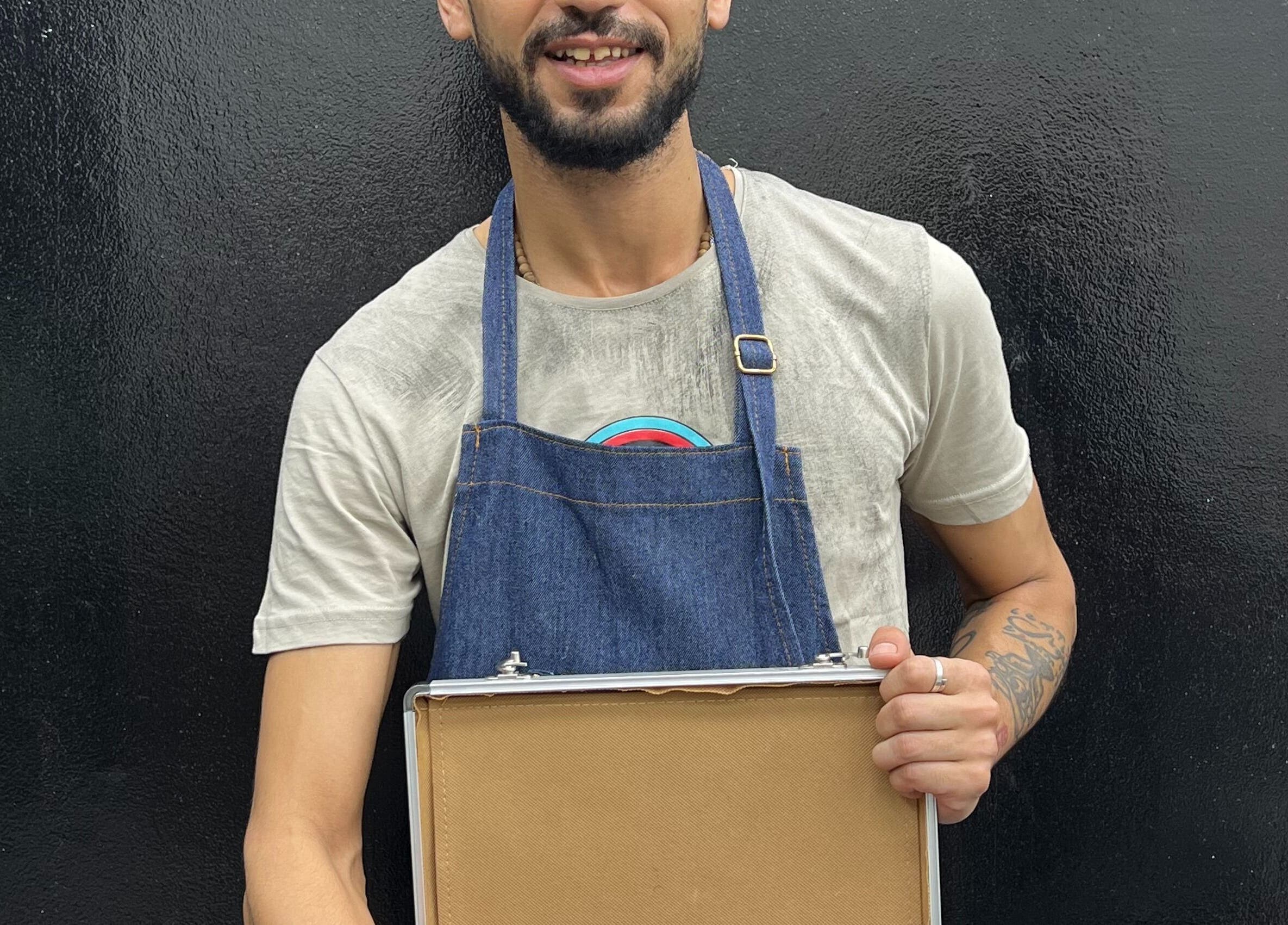 Man at Glowing Gents Salon and SPA, Dubai, AE ready for service with a professional kit.