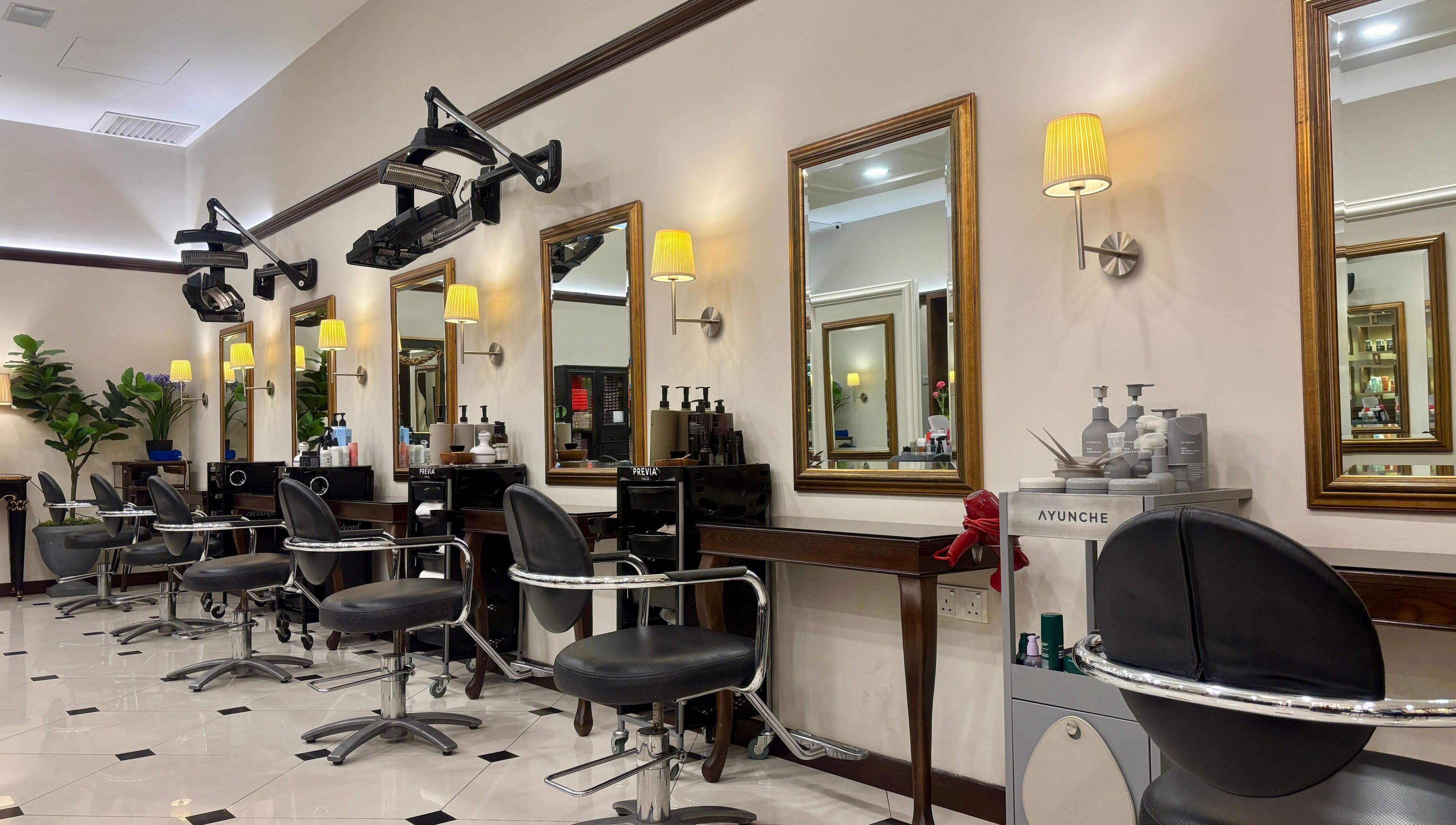 Interior of Andy Ho Haute Coiffure, Kuala Lumpur with stylish salon chairs and mirrors.