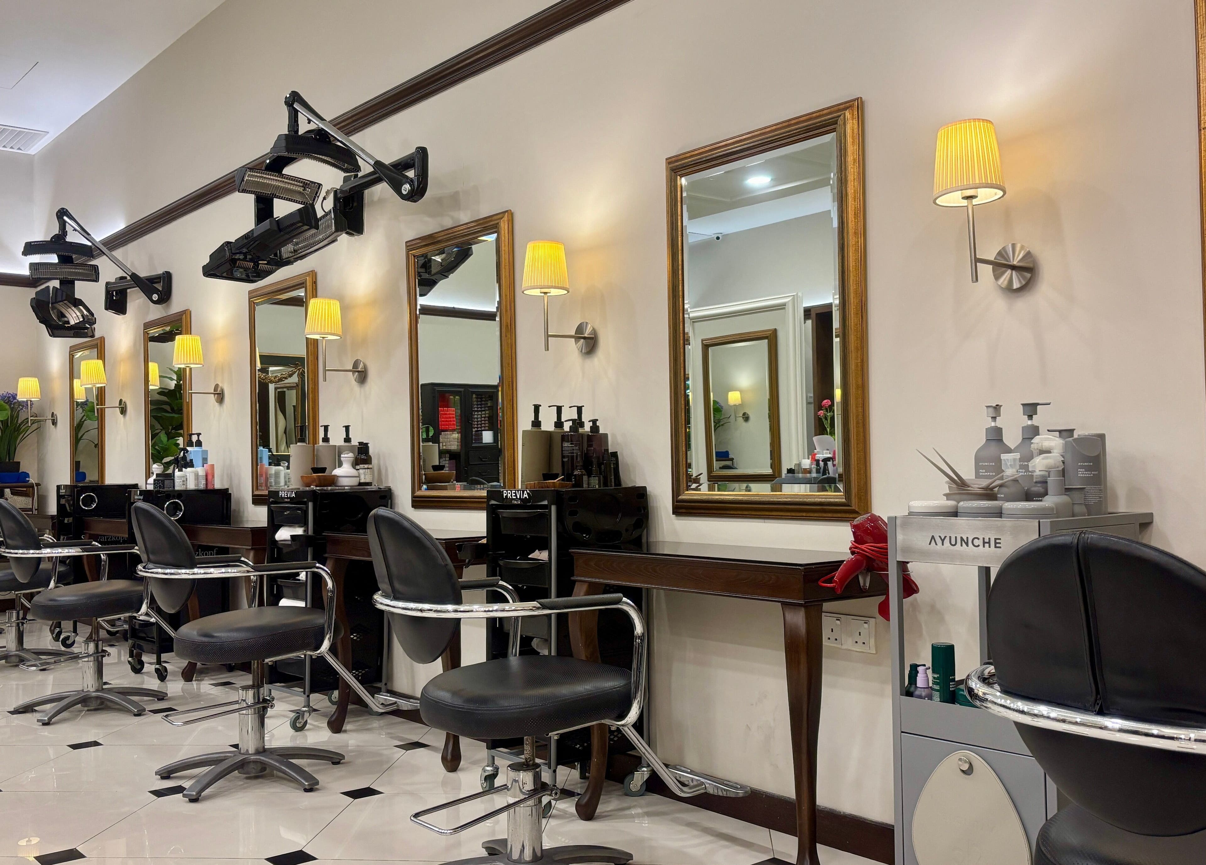 Interior of Andy Ho Haute Coiffure, Kuala Lumpur with stylish salon chairs and mirrors.