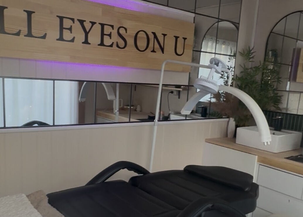 Modern treatment room at All Eyes On U, Melbourne, Victoria, AU with sleek design and comfortable black chair.