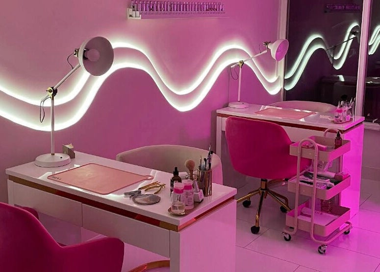 Elegant nail salon setup at Nails By Ash, East Boldon, England, GB with pink decor and modern lighting.