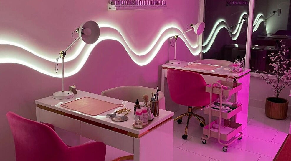 Elegant nail salon setup at Nails By Ash, East Boldon, England, GB with pink decor and modern lighting.