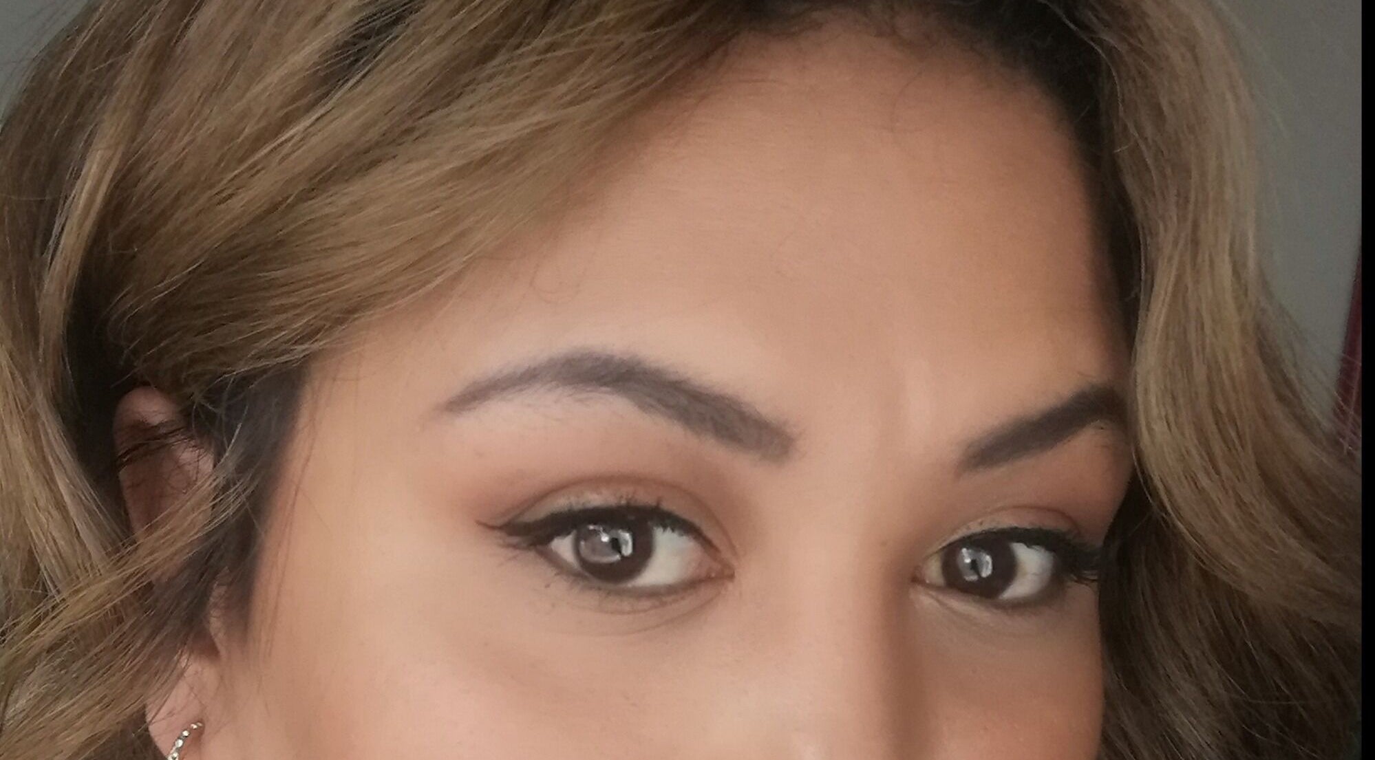 Close-up of well-groomed eyebrows from Nails & Beauty by Ilahm, Gqeberha, Eastern Cape, ZA showcasing detailed makeup.
