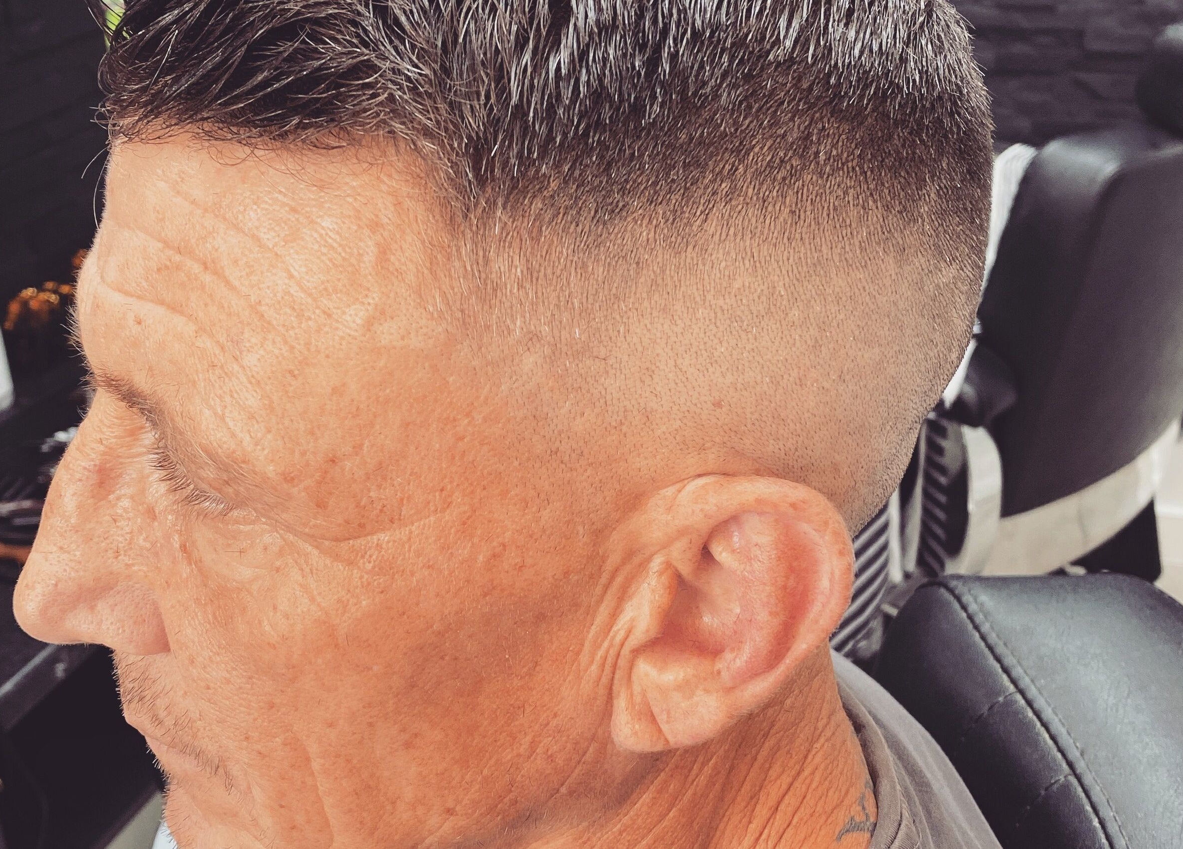 Close-up of a stylish fade haircut at Andre’s Barber Shop, Brighton And Hove, England, GB.