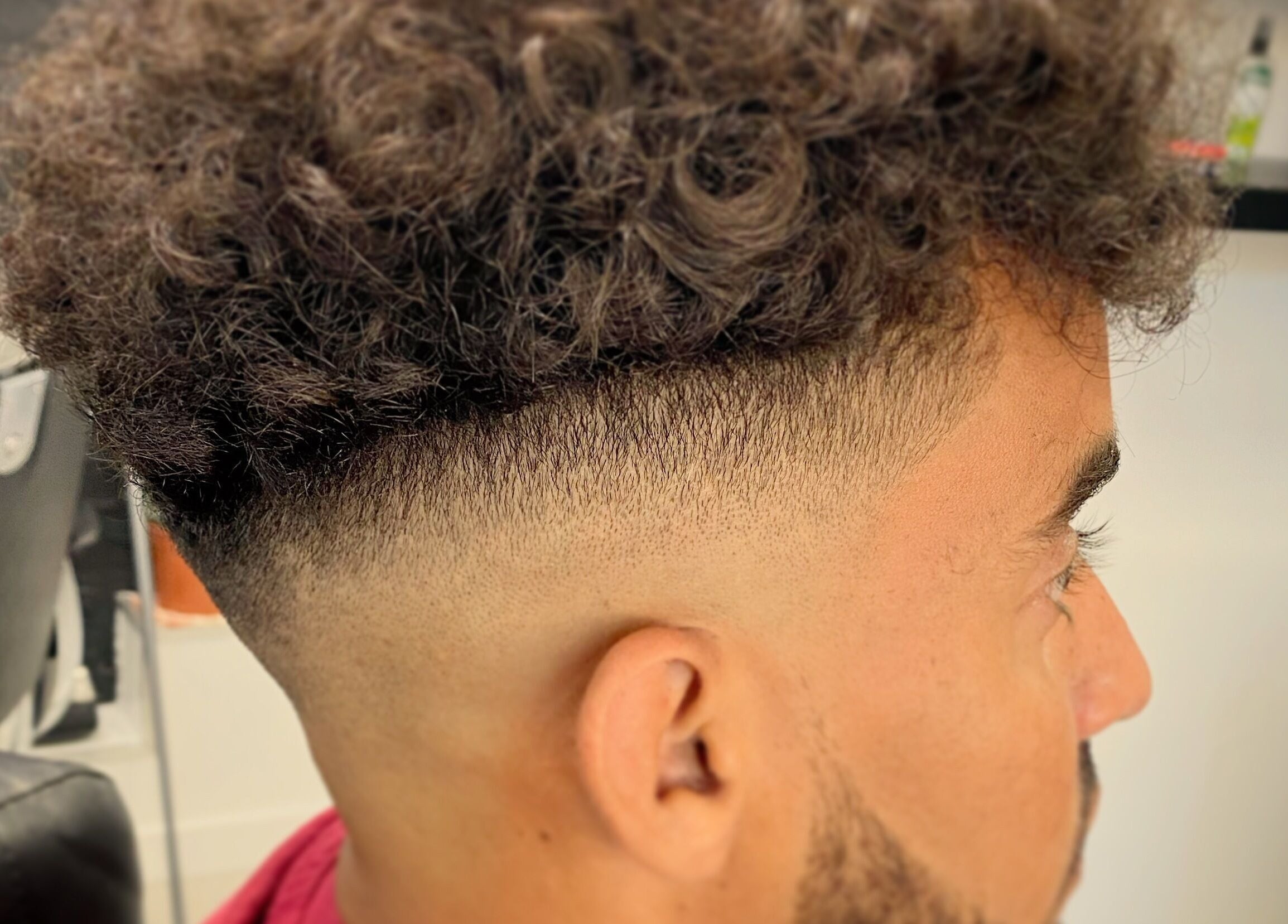 Close-up of a crisp fade haircut at Andre’s Barber Shop in Brighton And Hove, England, GB.