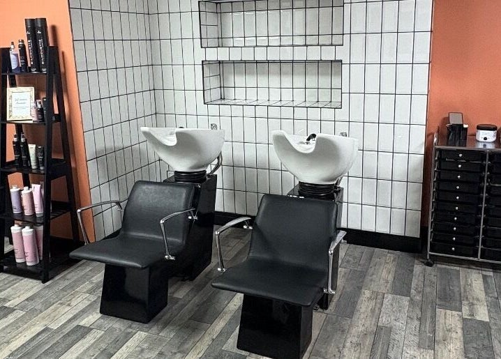 Modern hair wash chairs at LS Studio, Rotherham, England, GB, with sleek storage and contemporary decor.