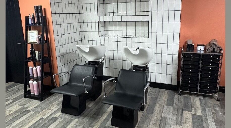 Modern hair wash chairs at LS Studio, Rotherham, England, GB, with sleek storage and contemporary decor.