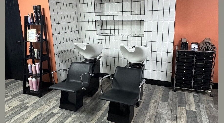 Modern hair wash chairs at LS Studio, Rotherham, England, GB, with sleek storage and contemporary decor.