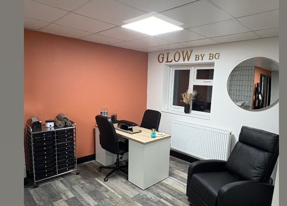 Tranquil beauty room at LS Studio, Rotherham, England, GB with sleek black chairs and rustic decor.