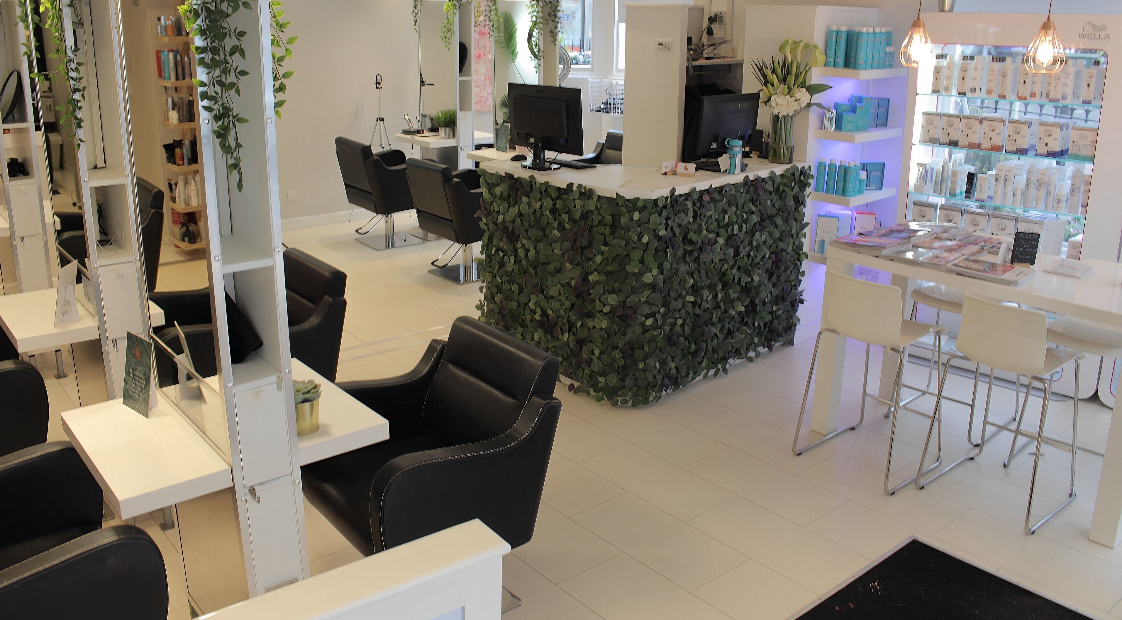 Elegant interior of Allan Caldow Hair @ Caldow Collective in Edinburgh, Scotland, GB with stylish seating and decor.