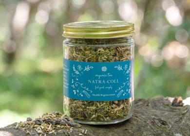 Jar of organic herbal tea from NatraColl Health, Kingscliff, New South Wales, AU, showcasing natural ingredients.