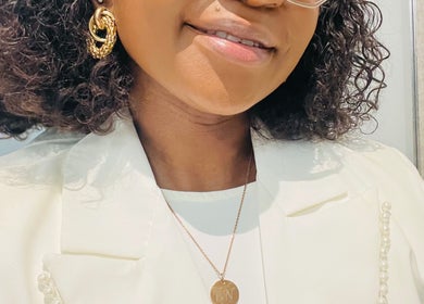 Person with curly hair and gold earrings at Mind&Soul ~ Psychological Services, Pretoria, Gauteng, ZA.