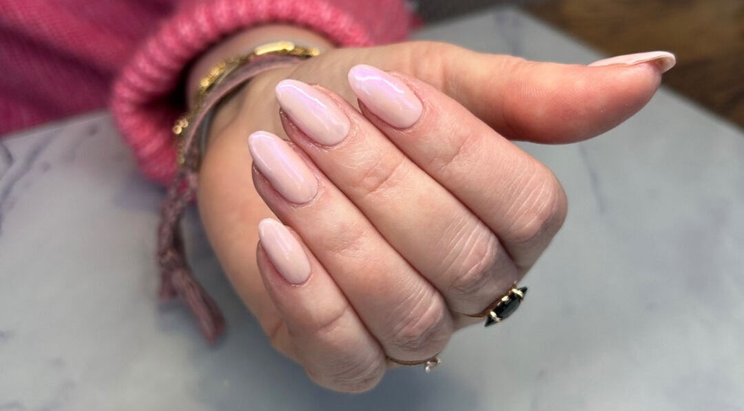 Beautiful manicured nails at Urban Beauty Studio, Godalming, England, GB showcasing soft pastel polish.