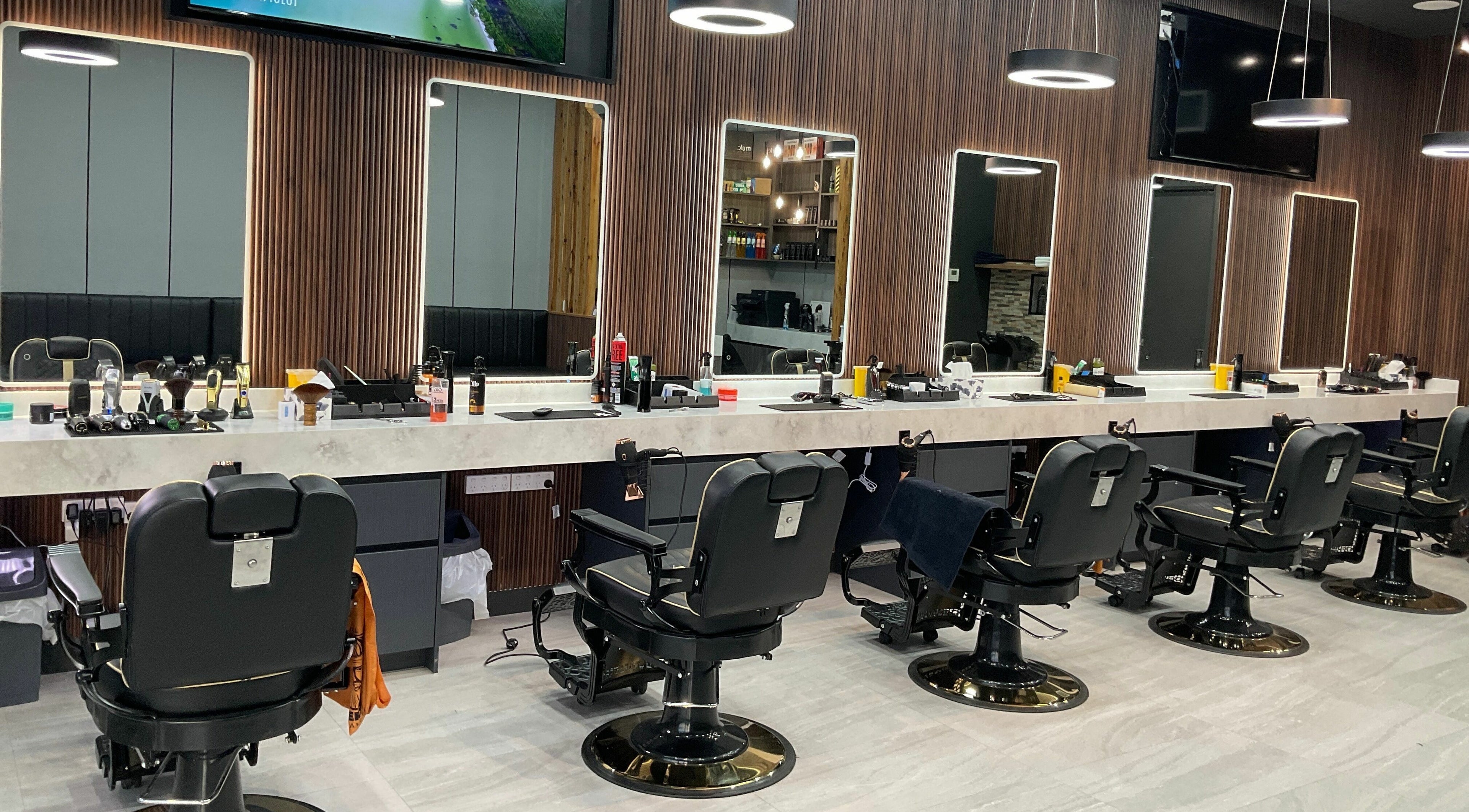 Modern barber chairs at Big Legends Barber, located in Melbourne, Victoria, AU, showcasing sleek design and style.