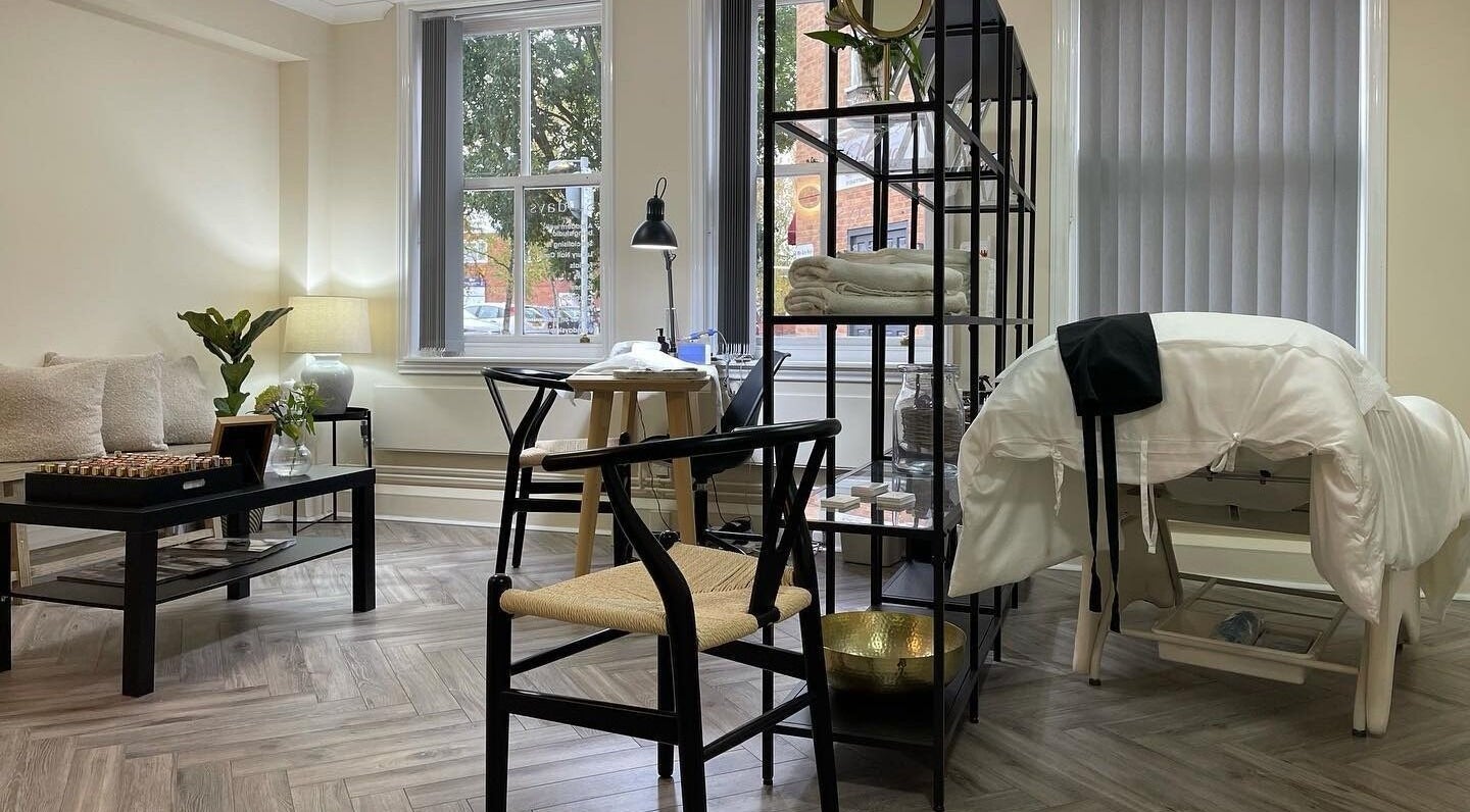 Tranquil interior of Sundays wellness center in Knowle, England, GB with a massage table and seating area.