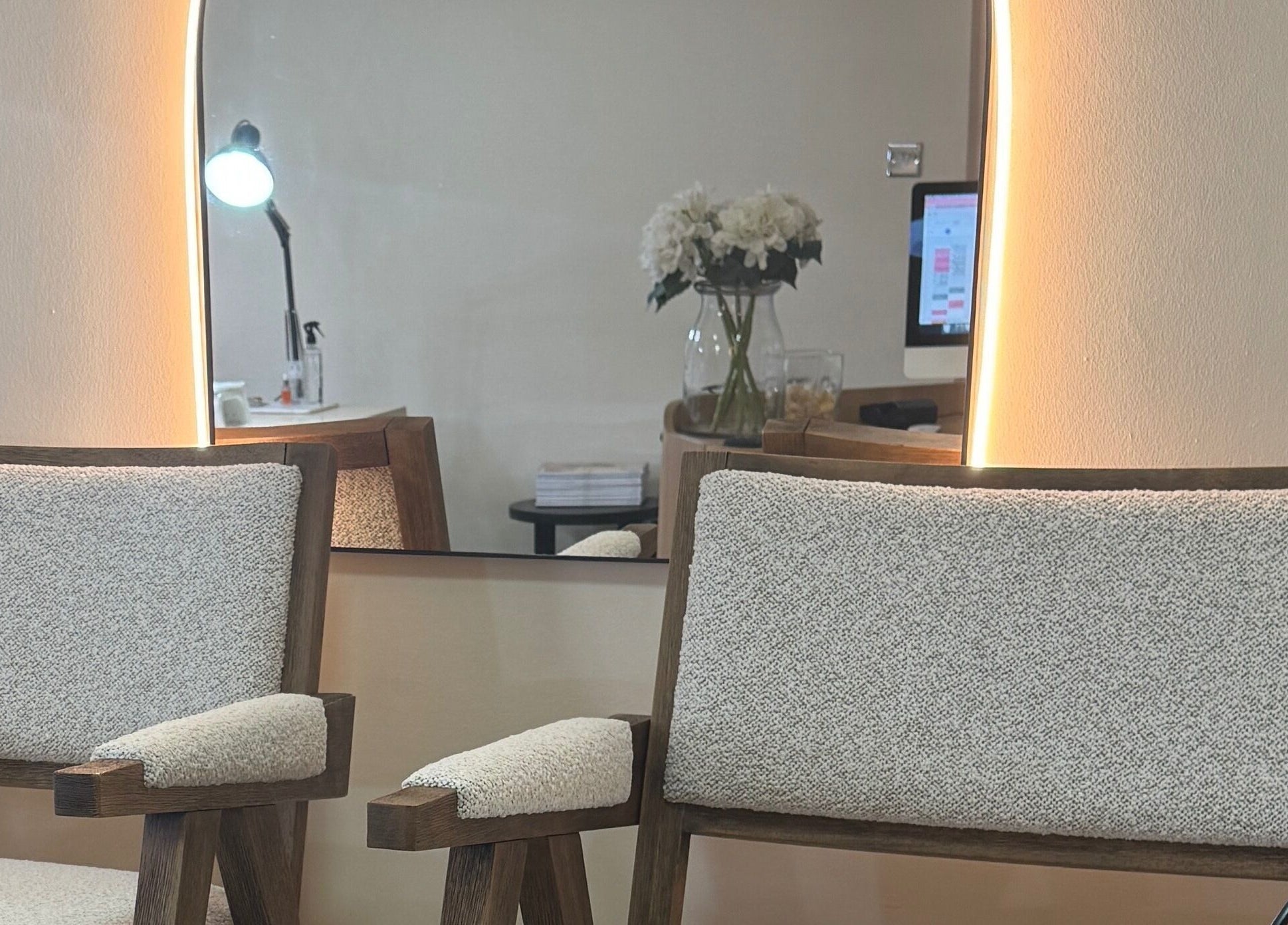 Cozy chairs with a mirror at Sundays, Knowle, England, GB, creating a welcoming atmosphere.