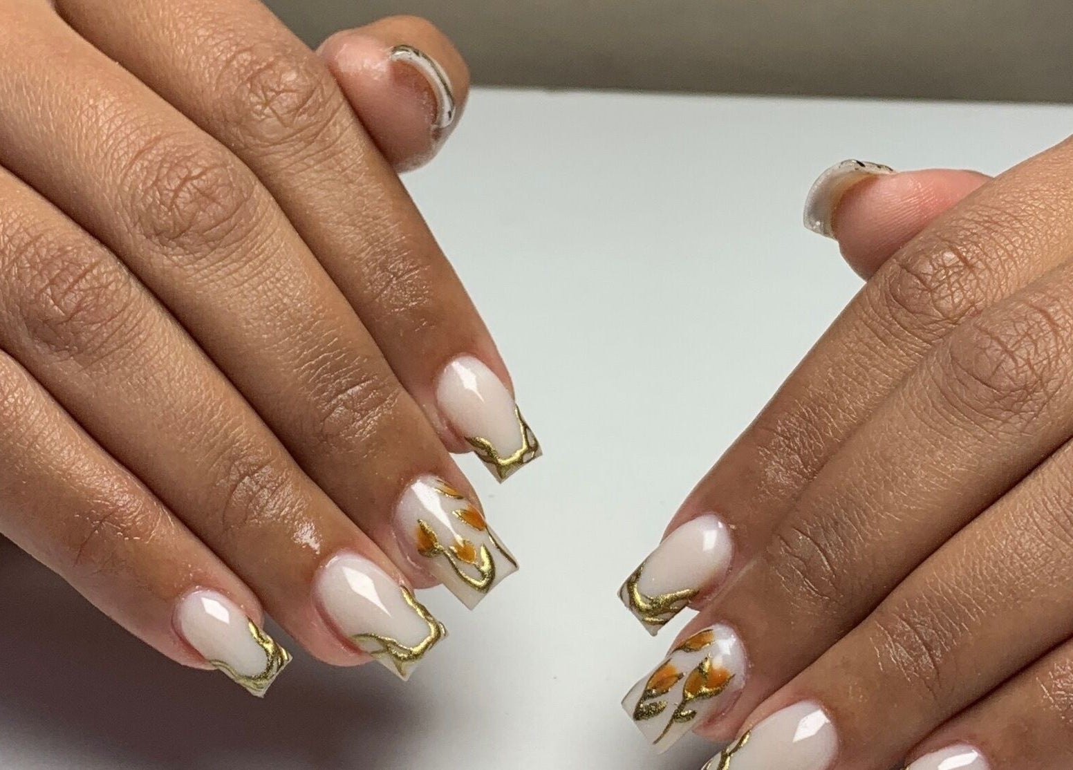 Elegant gold-accented nails at CLAWZ, Cape Town, Western Cape, ZA, showcasing professional nail art.