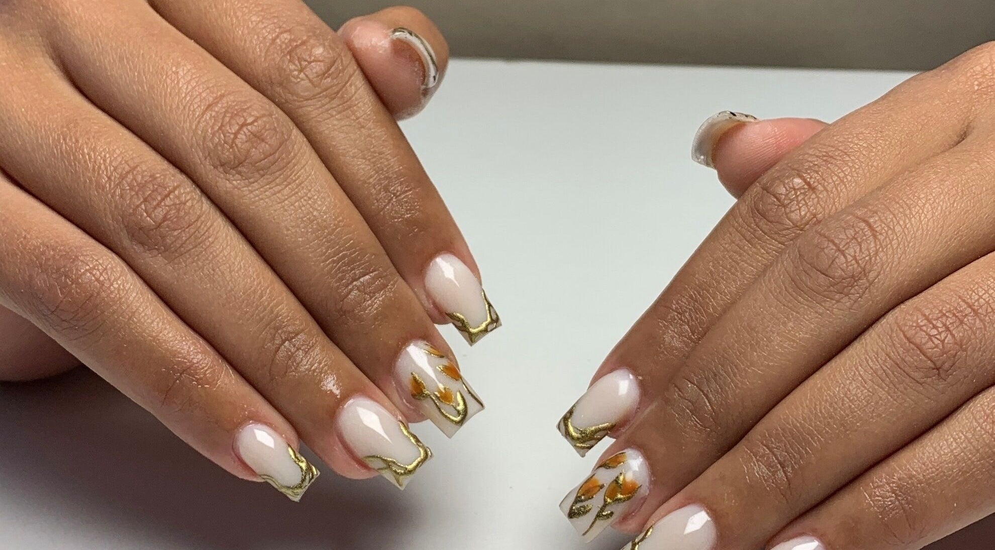 Elegant gold-accented nails at CLAWZ, Cape Town, Western Cape, ZA, showcasing professional nail art.