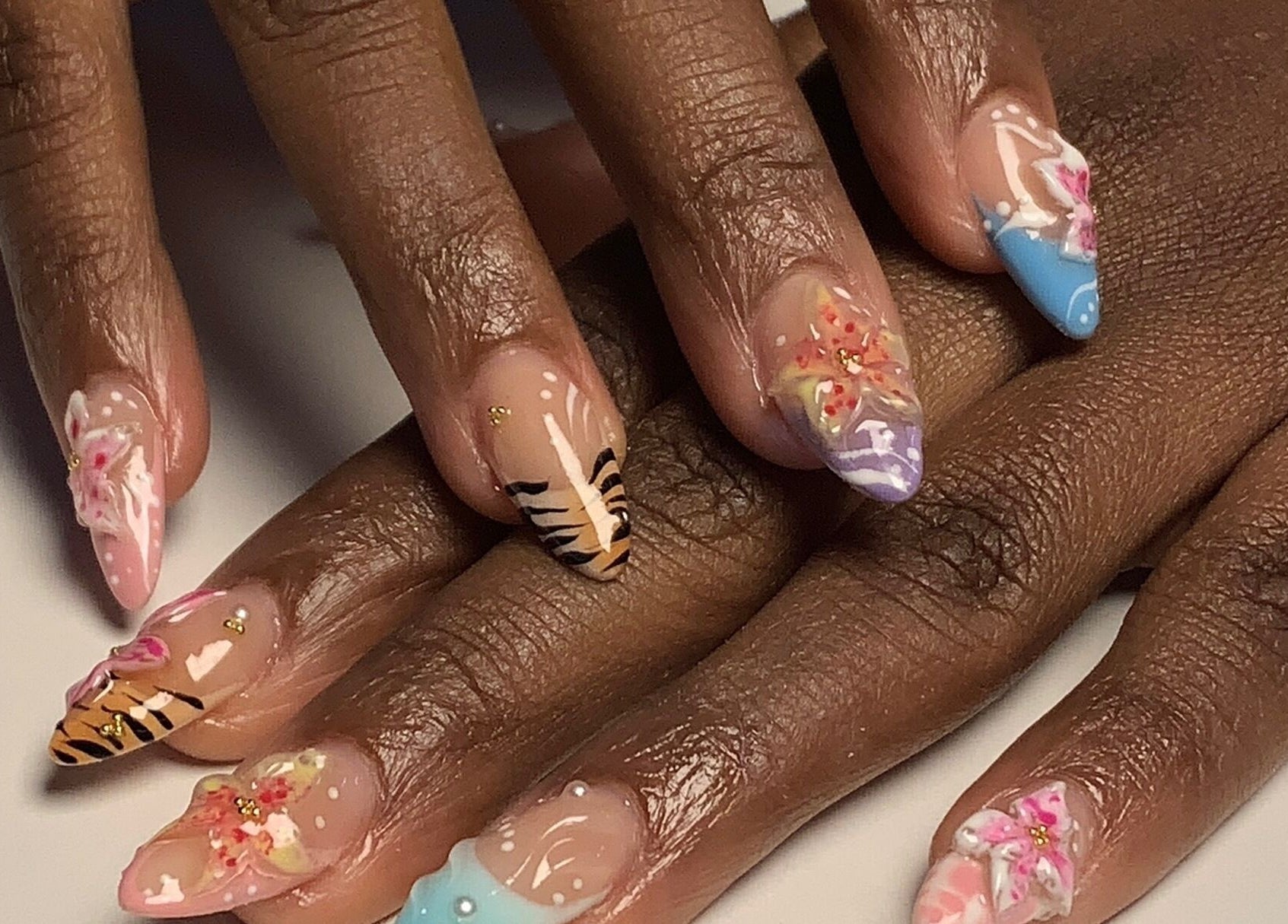Intricate floral nail designs at CLAWZ, Cape Town, Western Cape, ZA showcasing vibrant creativity.