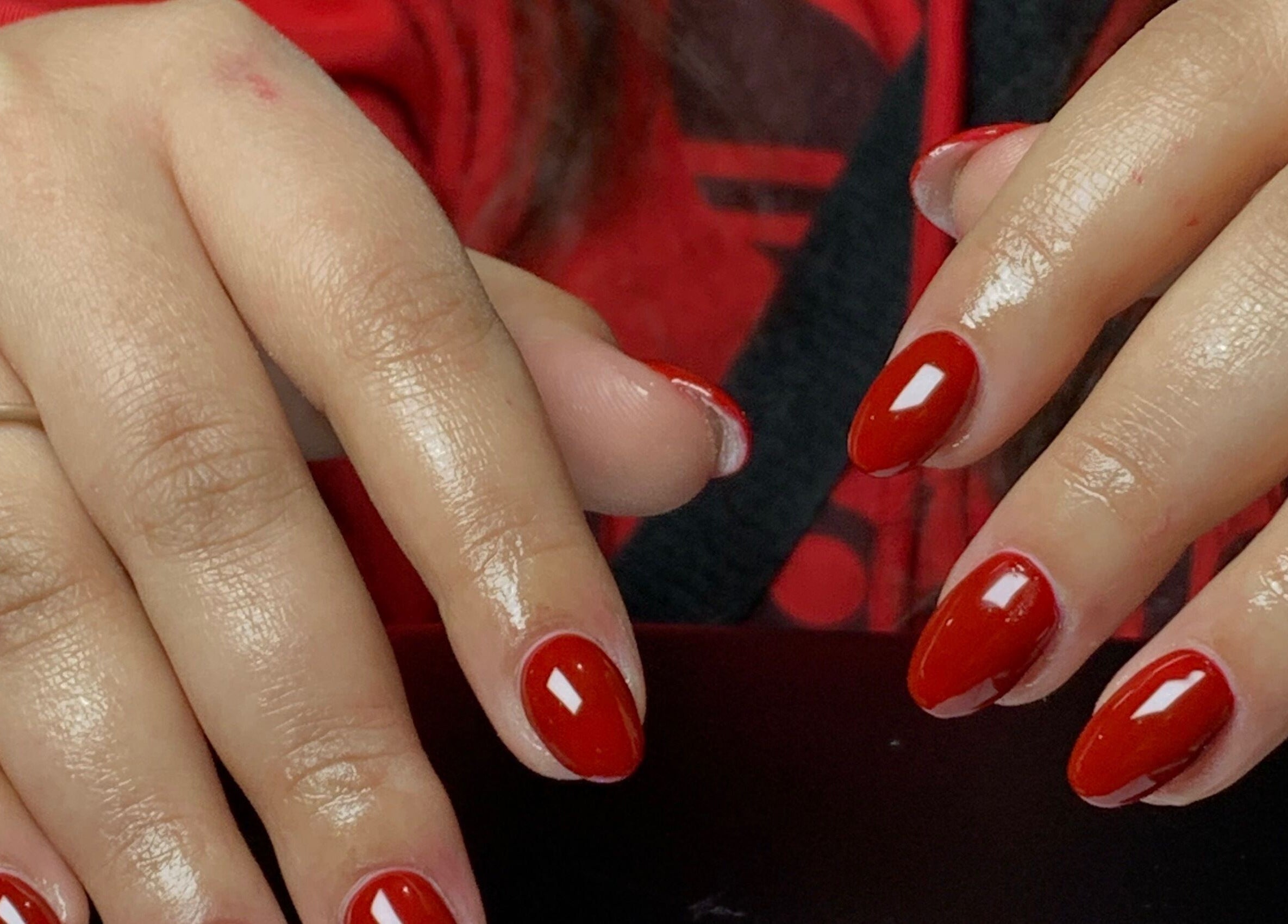 Elegant red manicured nails at CLAWZ, Cape Town, Western Cape, ZA, showcasing expert nail artistry.