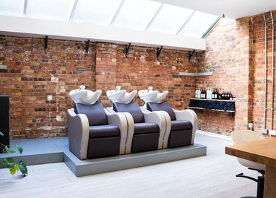 Chic wash station at Boo.colourist - East London, adorned with rustic brick walls in London, England, GB.