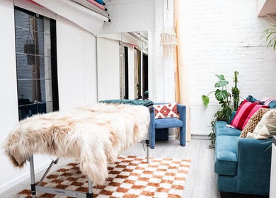 Stylish lounge at Boo.colourist - East London, featuring plush seating and serene decor. London, England, GB.