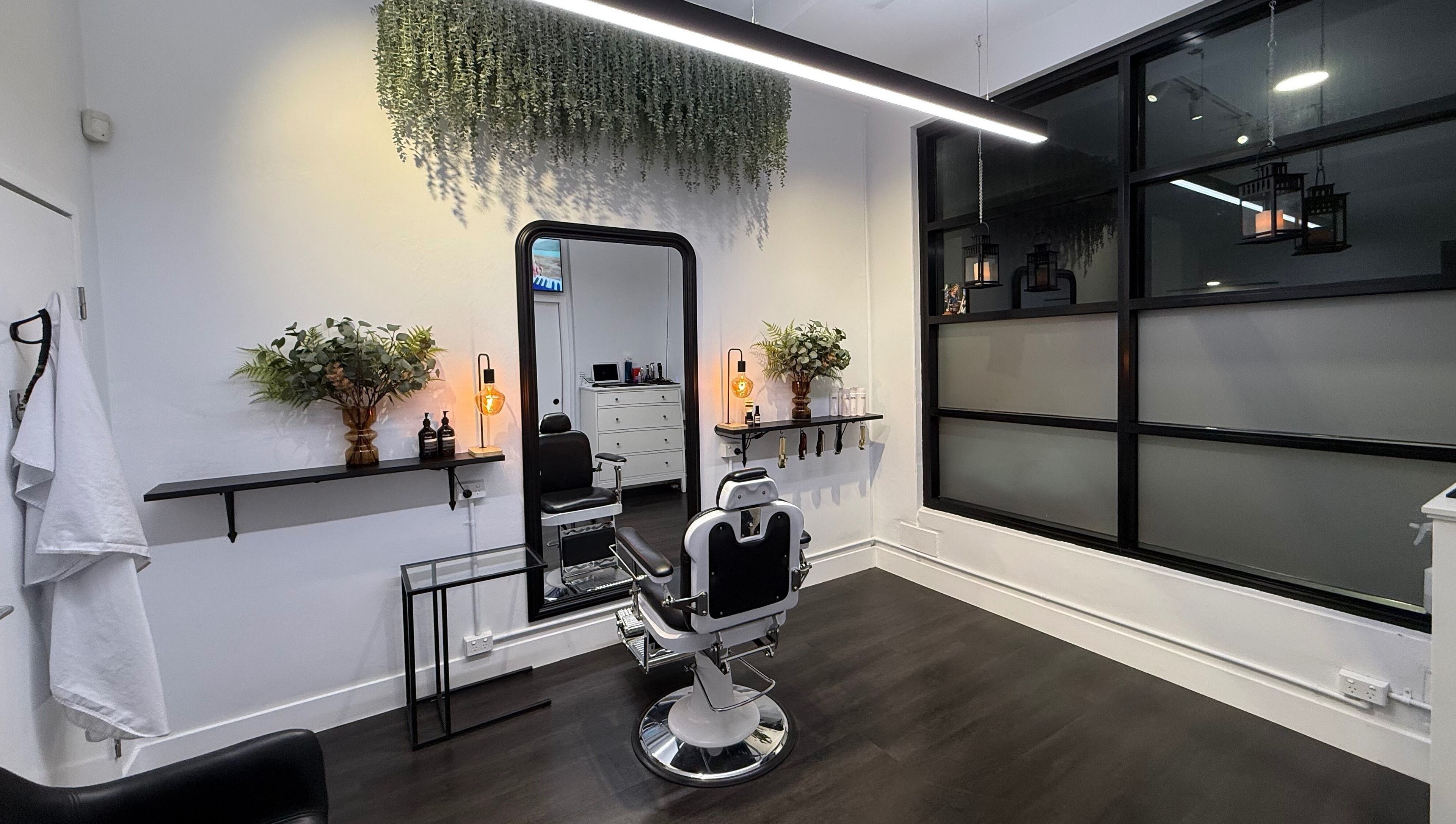 Modern salon interior at St Louis and Co, Kingsgrove, New South Wales, AU with stylish barber chair and decor.