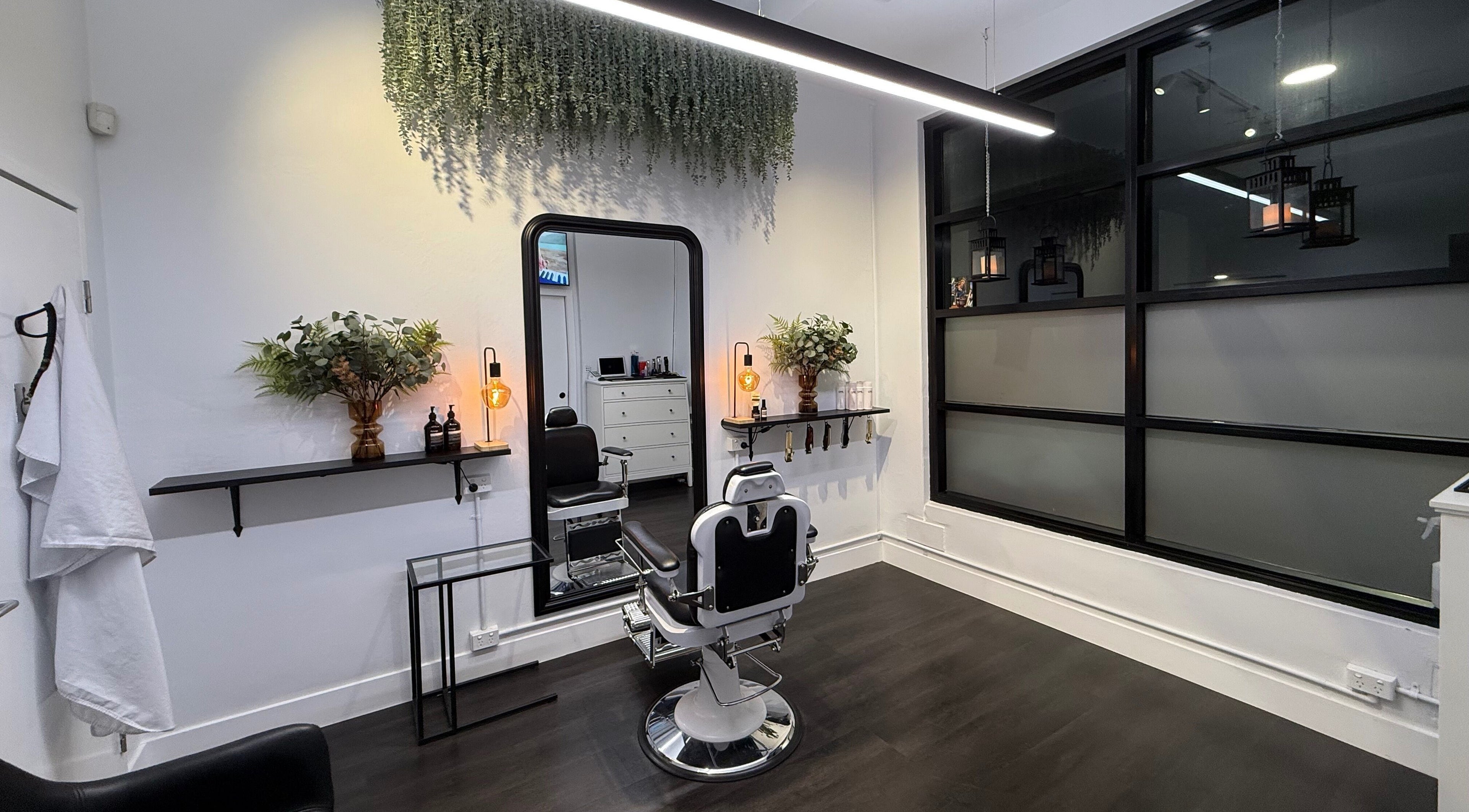 Modern salon interior at St Louis and Co, Kingsgrove, New South Wales, AU with stylish barber chair and decor.