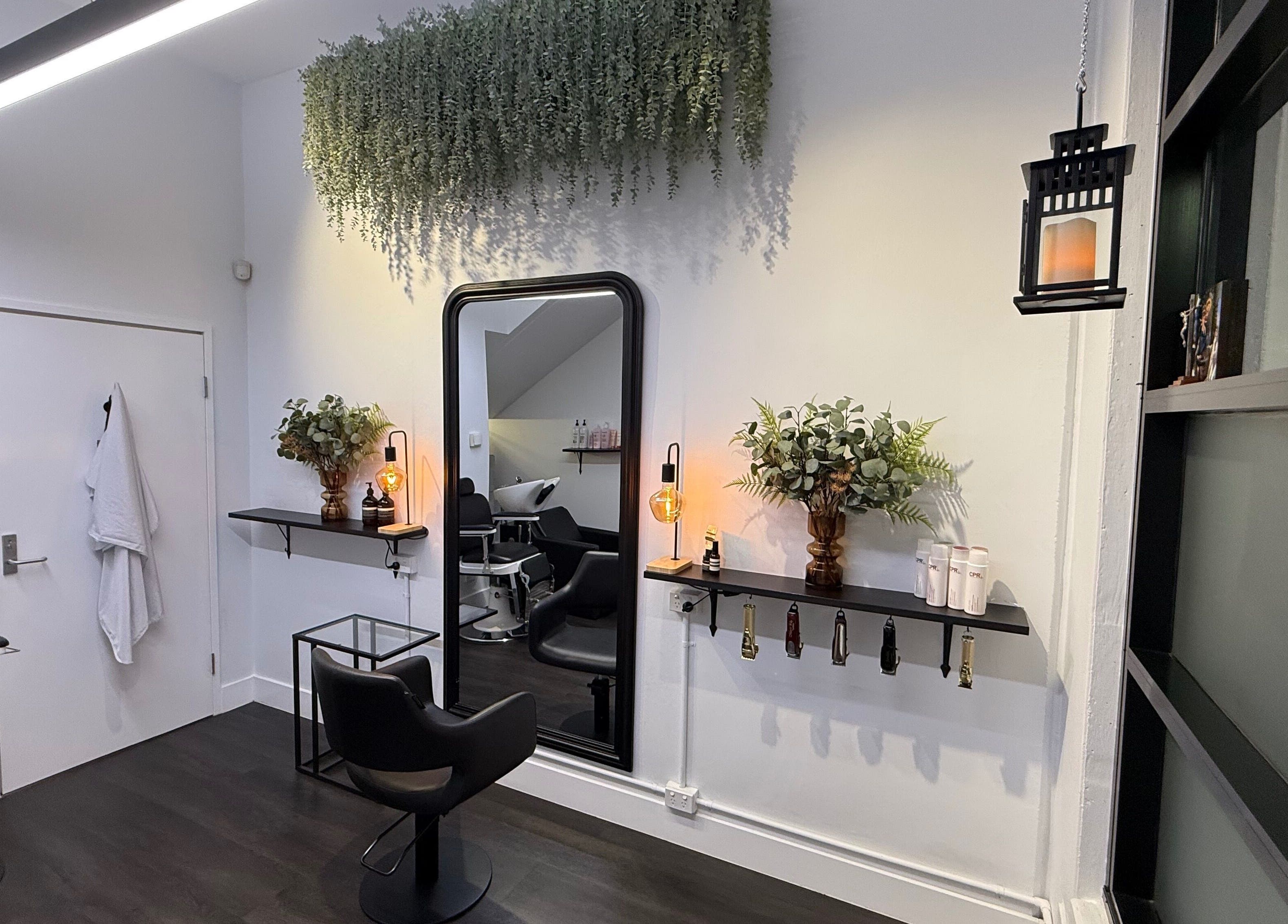 Chic salon interior at St Louis and Co, Kingsgrove, New South Wales, AU with modern decor and styling stations.