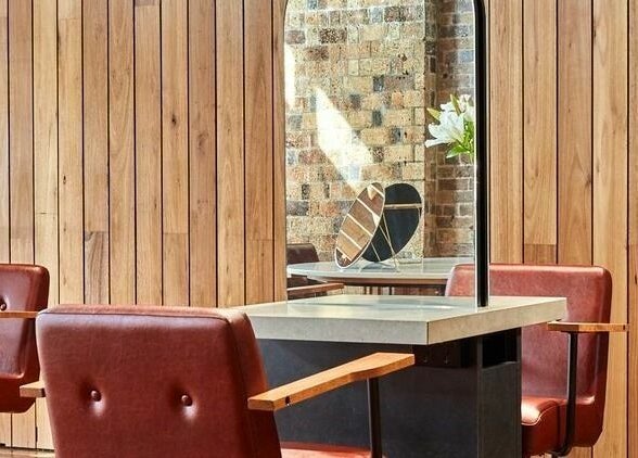 Stylish salon chairs and mirrors at Ella&Jade Woolloongabba, Woolloongabba, Queensland, AU.