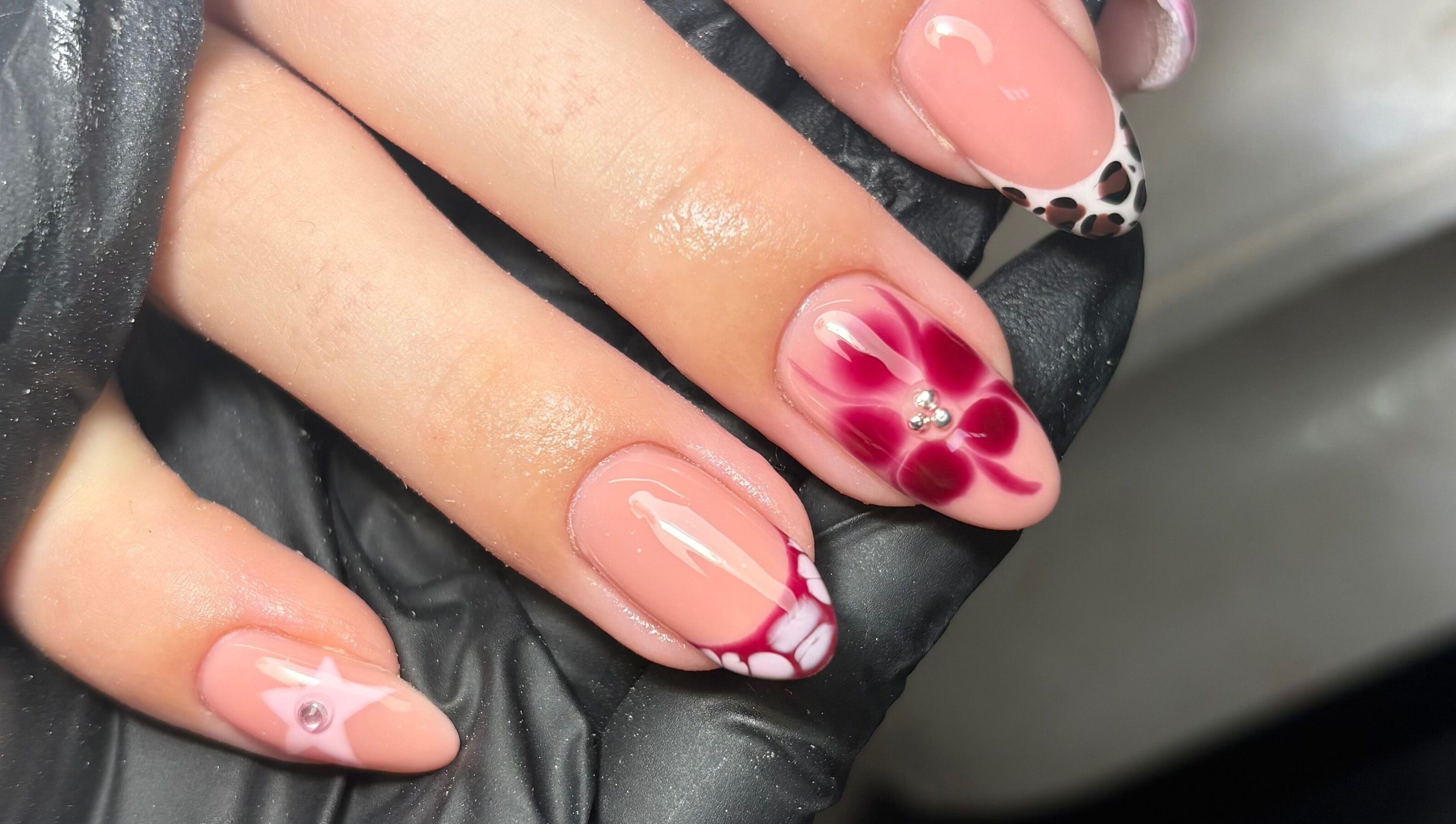 Intricate nail art with floral and cheetah patterns at Gels by Grace, Sunderland, England, GB.