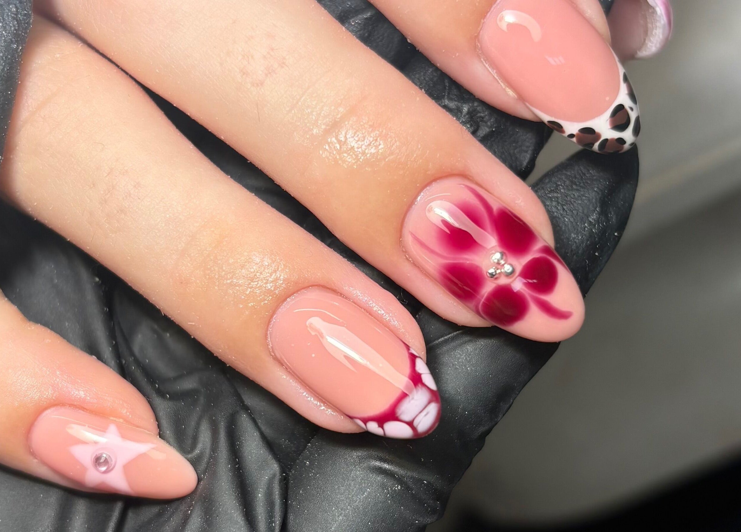 Intricate nail art with floral and cheetah patterns at Gels by Grace, Sunderland, England, GB.