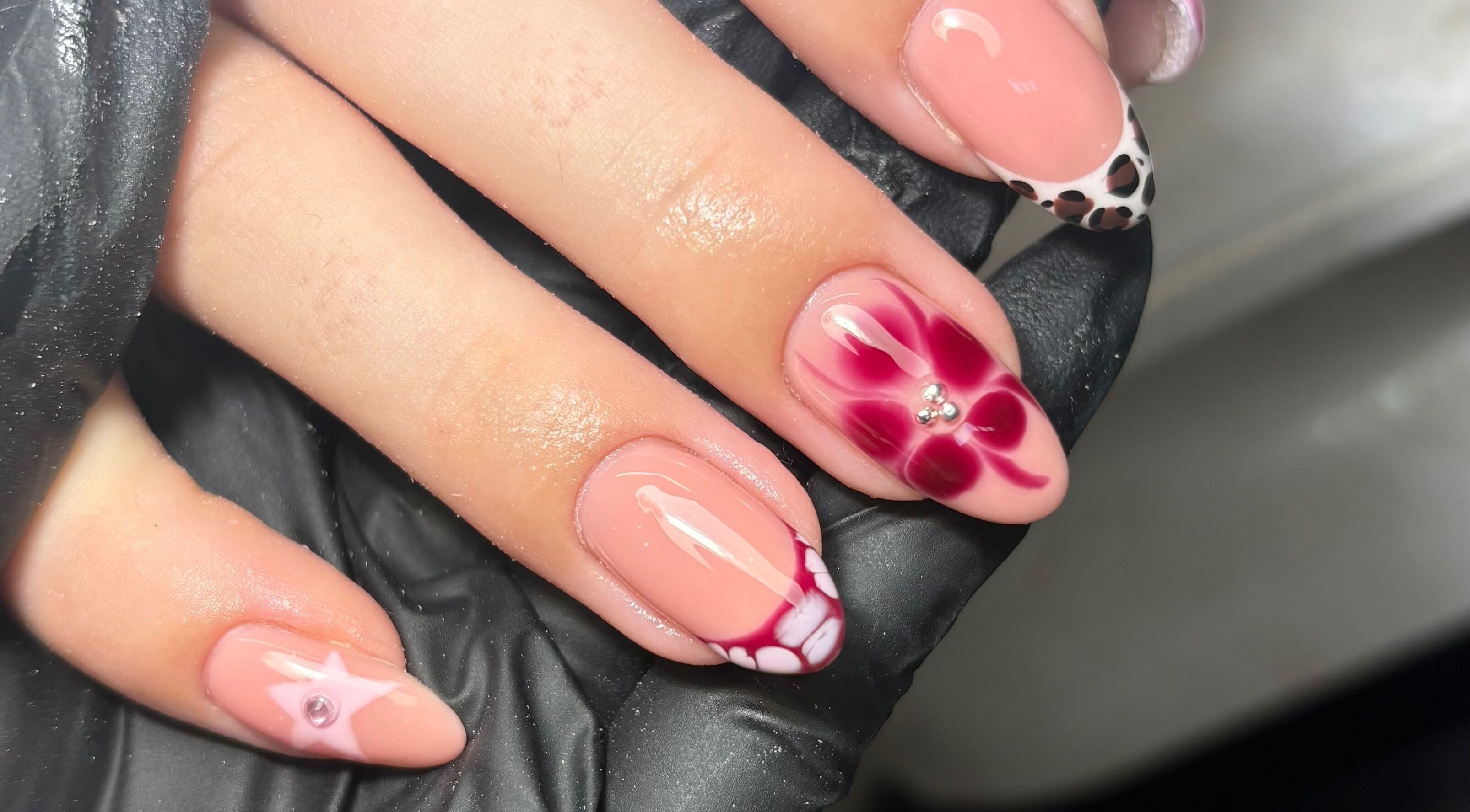 Intricate nail art with floral and cheetah patterns at Gels by Grace, Sunderland, England, GB.