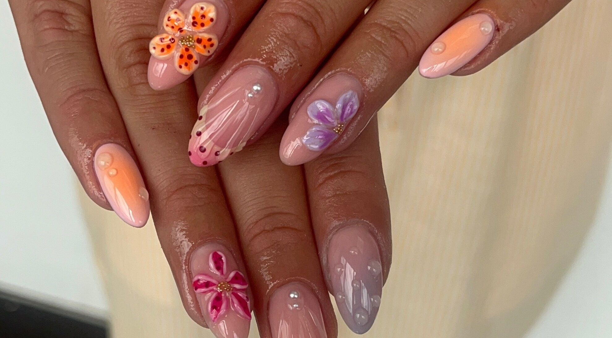 Stunning floral nail design at Gels by Grace, Sunderland, England, GB. Perfectly manicured hands.