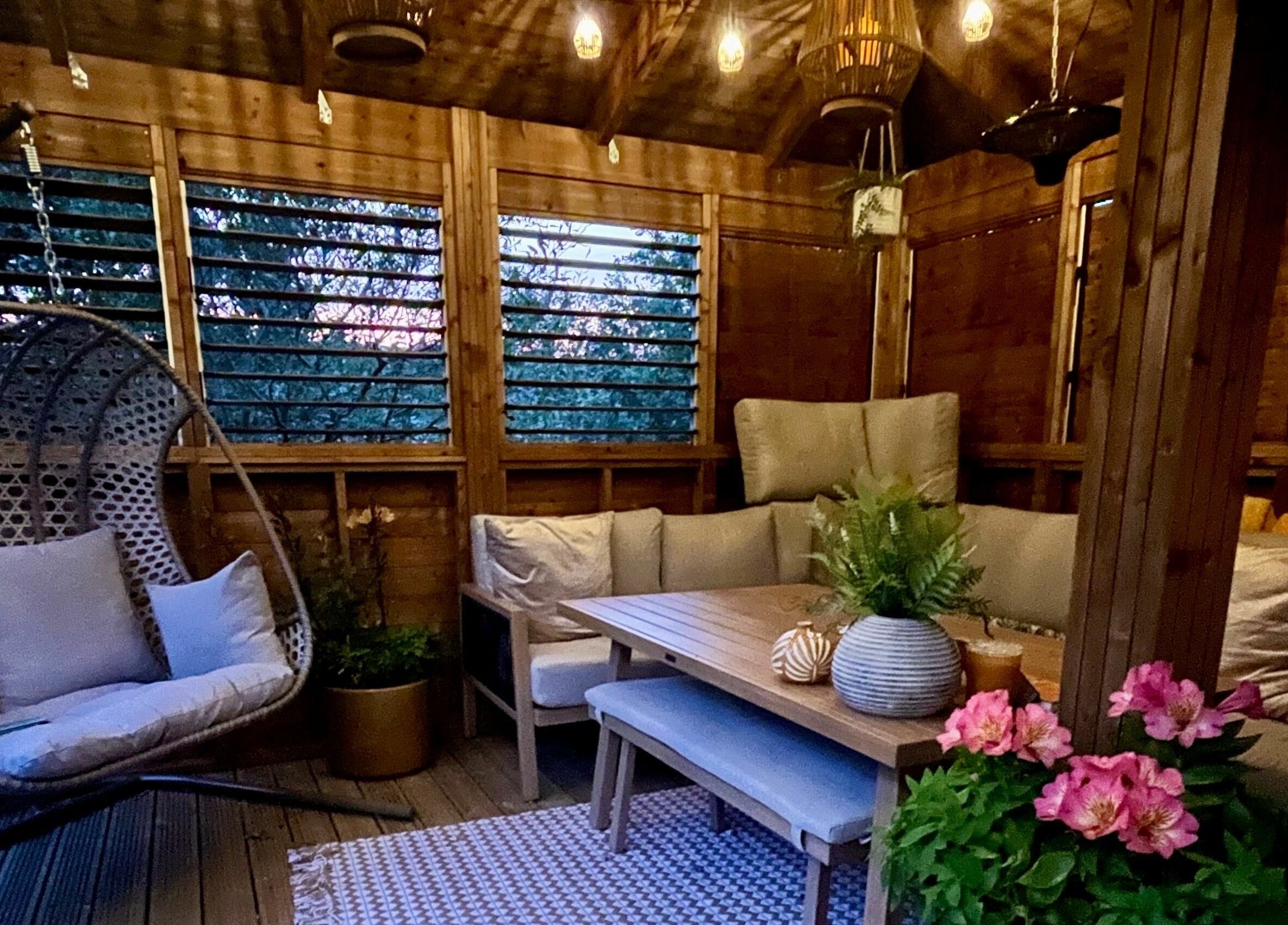 Relaxing seating area in Tranquility Treatment Room, Whitworth, England, GB, with lush decor and serene ambiance.