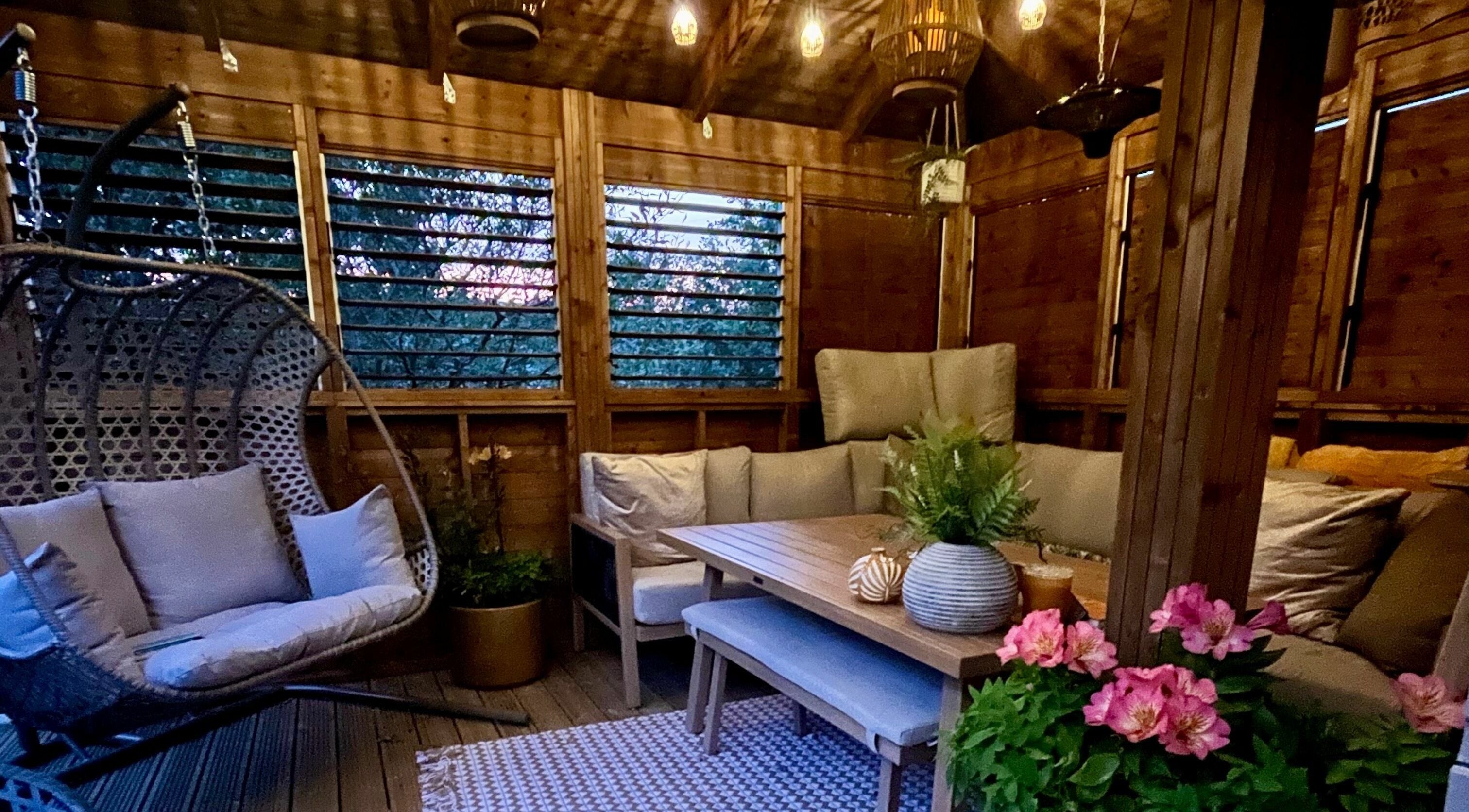 Relaxing seating area in Tranquility Treatment Room, Whitworth, England, GB, with lush decor and serene ambiance.
