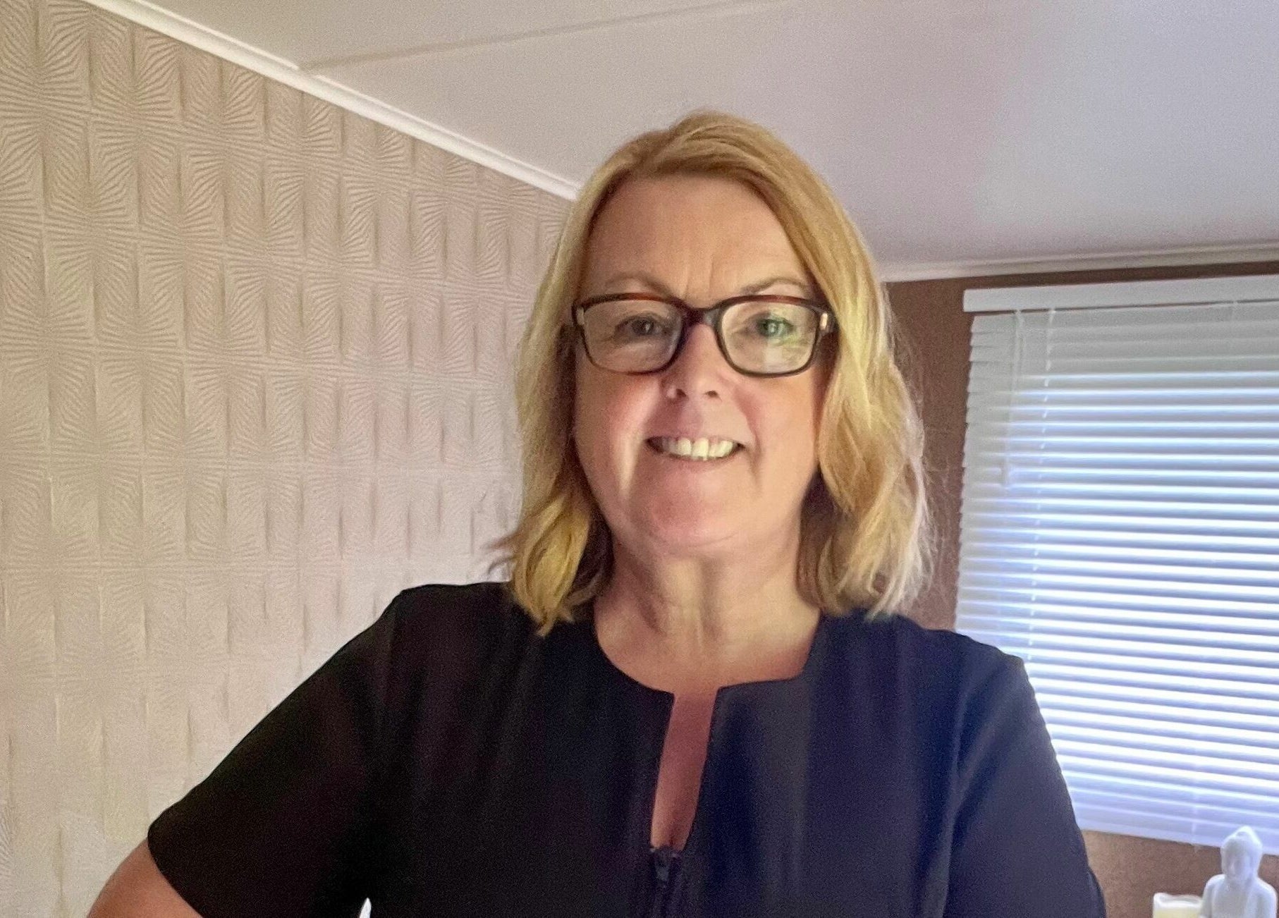 Professional in Tranquility Treatment Room, Whitworth, England, GB, embodies calm wellness expertise.