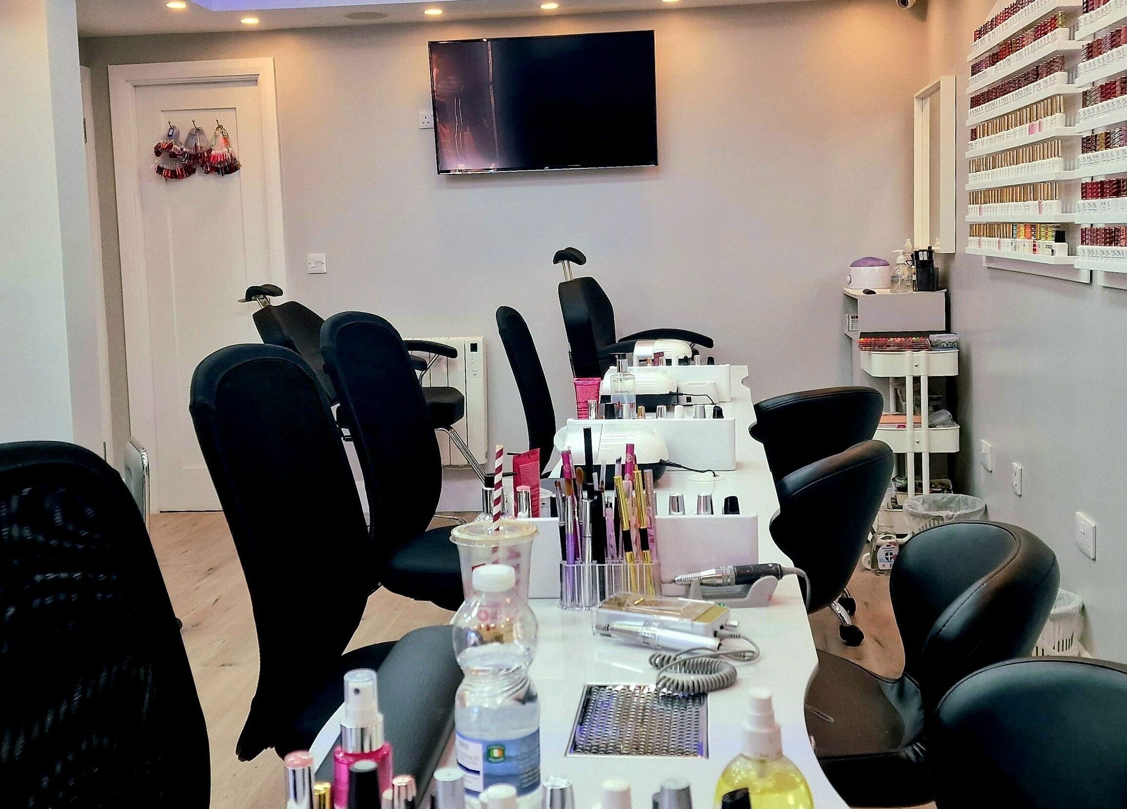 Modern nail service area at Kim.V Nails in Celbridge, County Kildare, IE with chic black chairs and nail polish display.