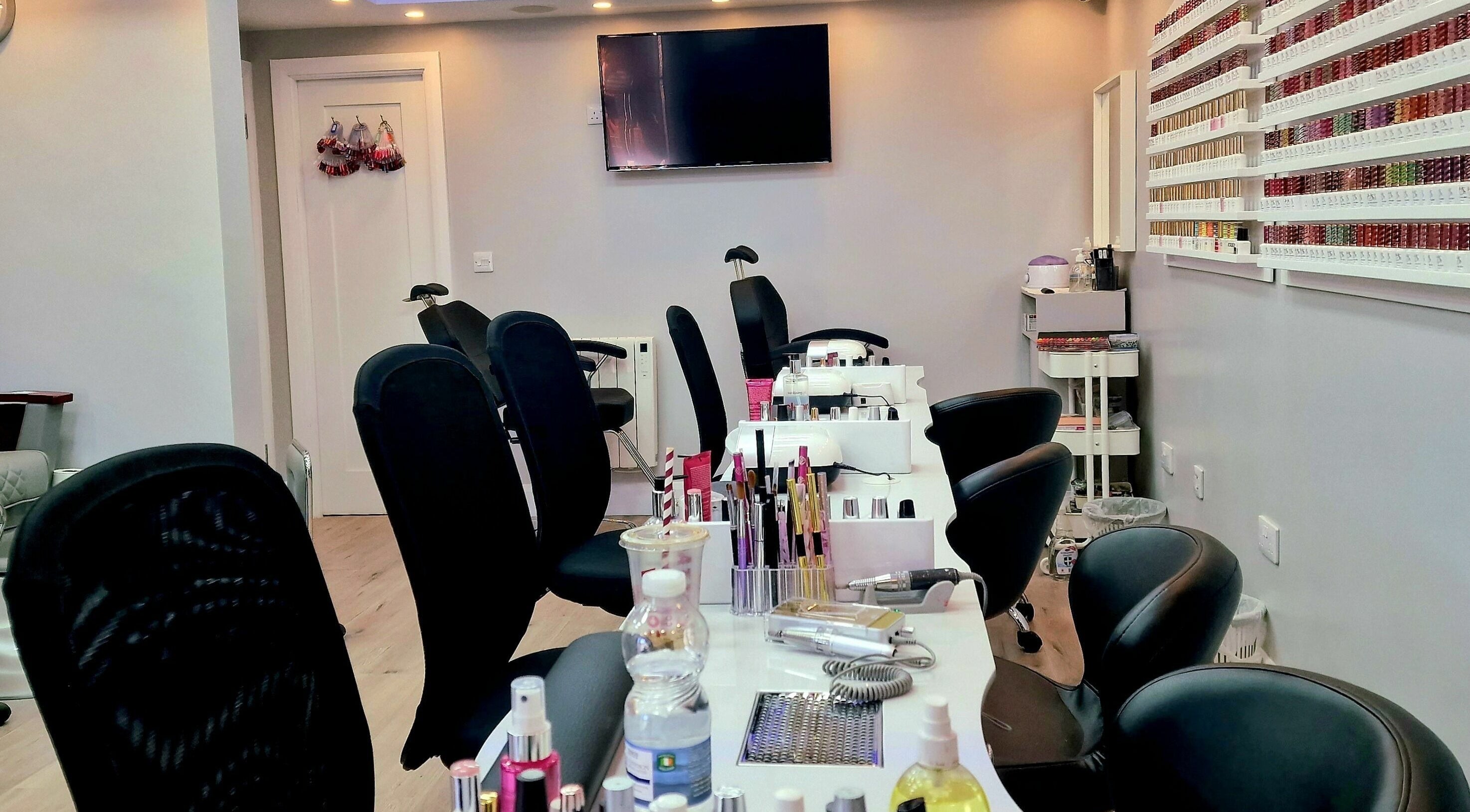 Modern nail service area at Kim.V Nails in Celbridge, County Kildare, IE with chic black chairs and nail polish display.