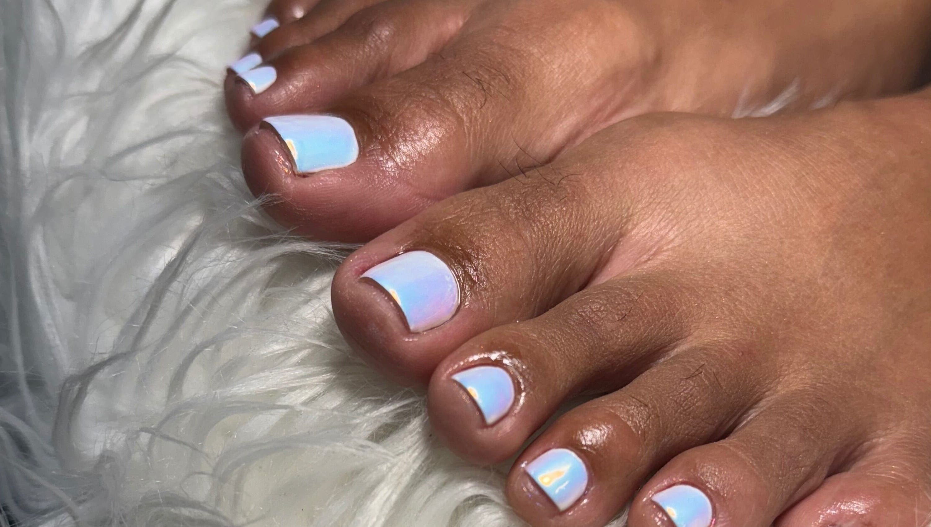 Iridescent toenails at Beaute Bomb by Natoya in Woodbrook, TT, showcasing expert nail artistry.