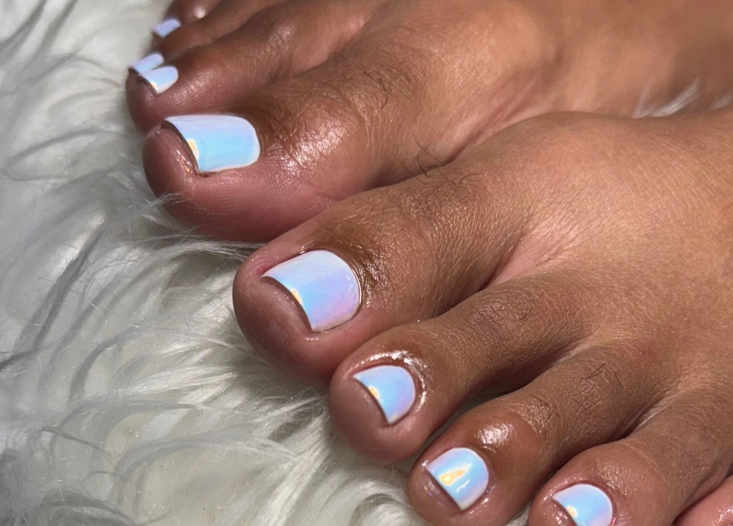 Iridescent toenails at Beaute Bomb by Natoya in Woodbrook, TT, showcasing expert nail artistry.