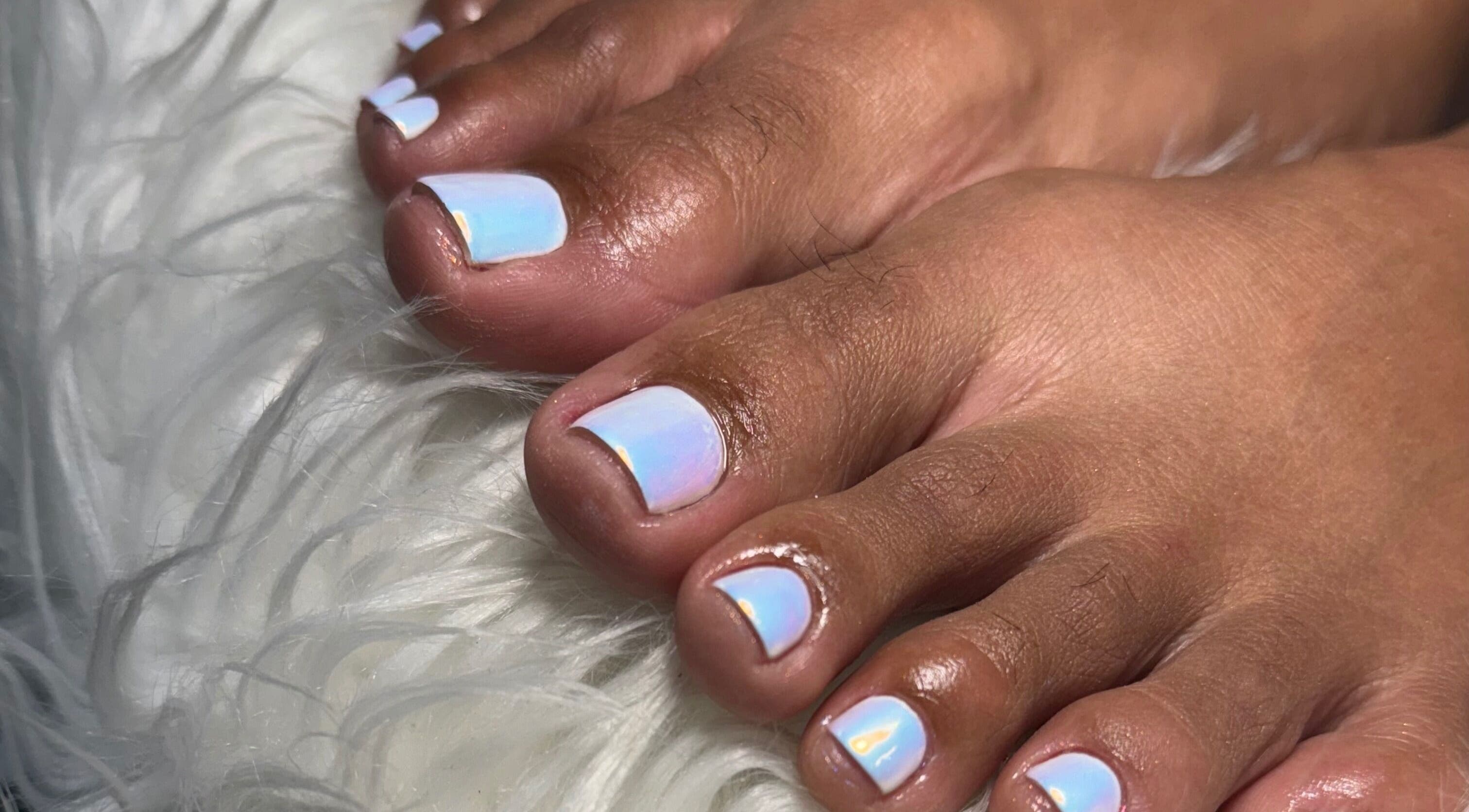 Iridescent toenails at Beaute Bomb by Natoya in Woodbrook, TT, showcasing expert nail artistry.