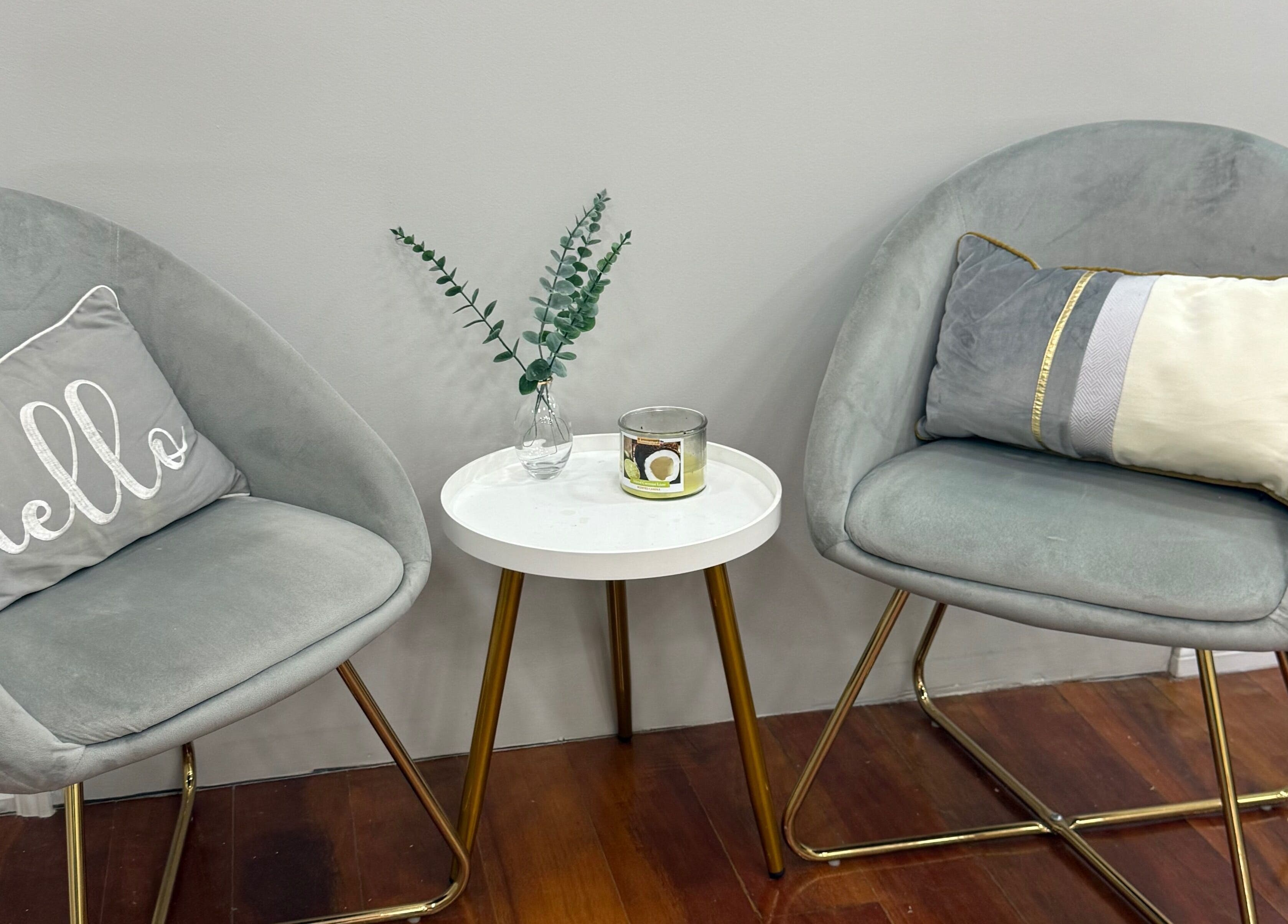 Stylish seating area at Beaute Bomb by Natoya in Woodbrook, TT featuring plush chairs and elegant decor.