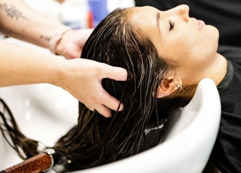 Woman enjoys a relaxing hair wash at La Belle Vie Salon and Spa, Pleasant Grove, Utah, US.