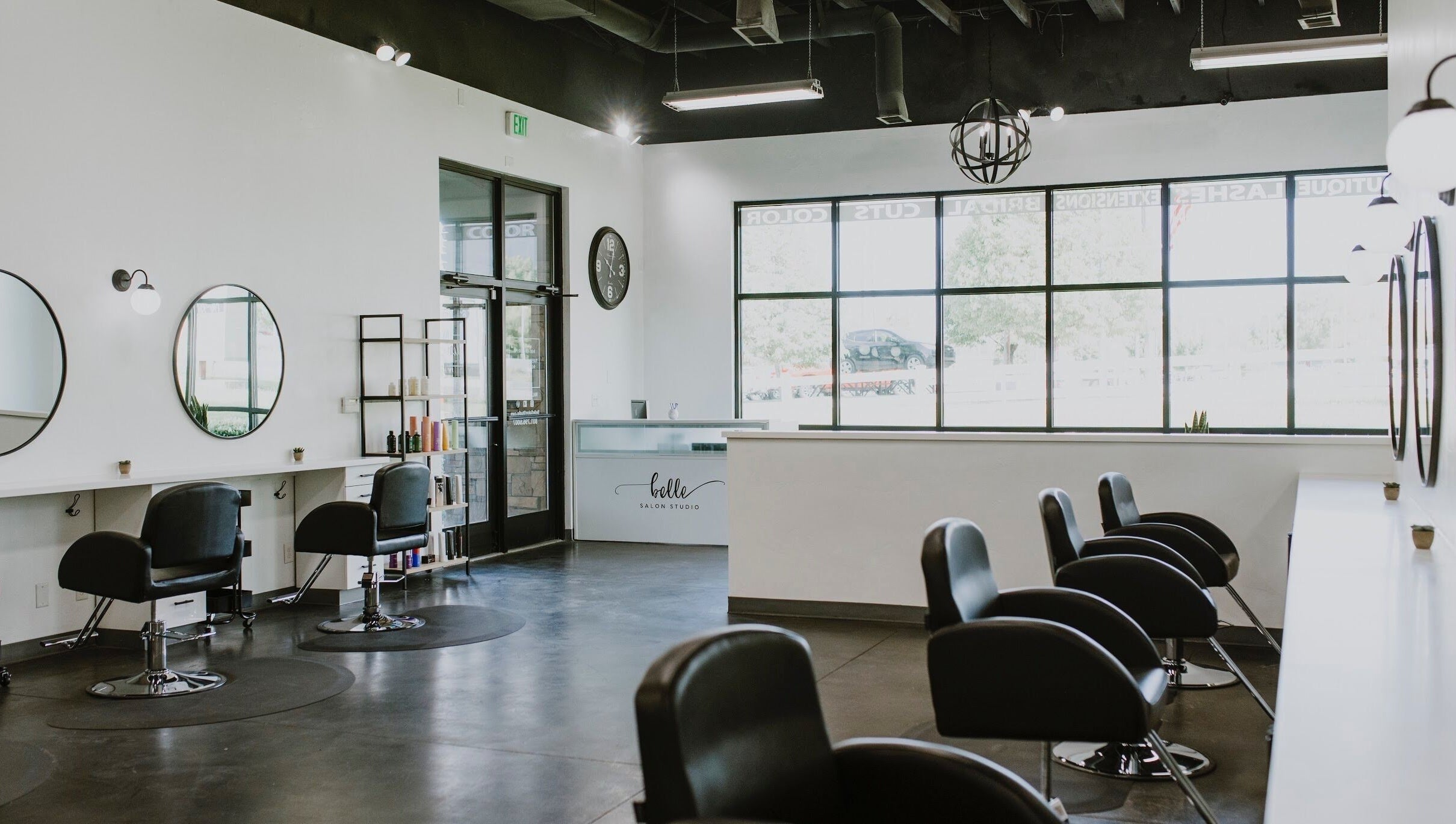 Interior of West Ivie Collective Beauty Lounge in Lindon, Utah, featuring stylish hair stations and mirrors.