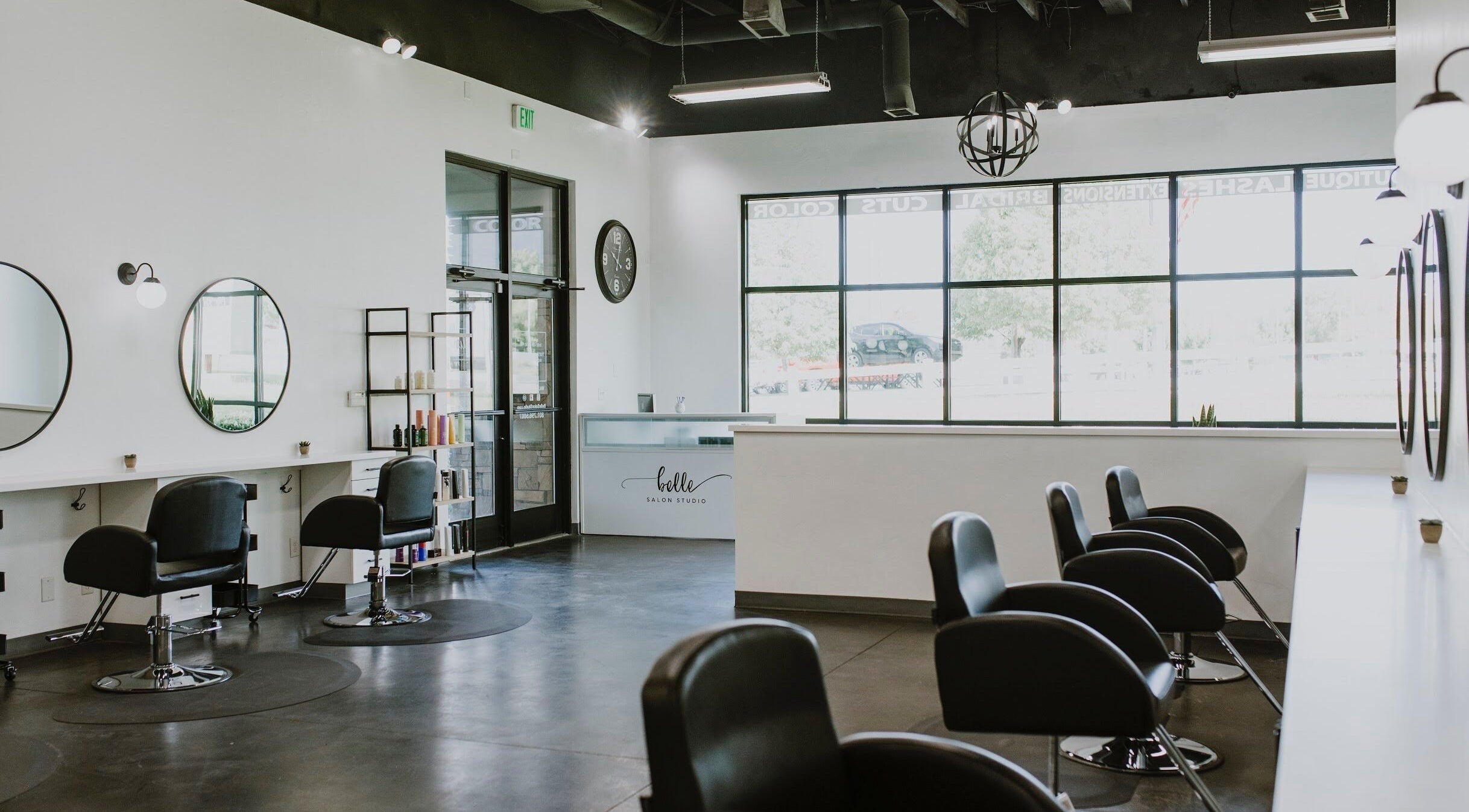 Interior of West Ivie Collective Beauty Lounge in Lindon, Utah, featuring stylish hair stations and mirrors.