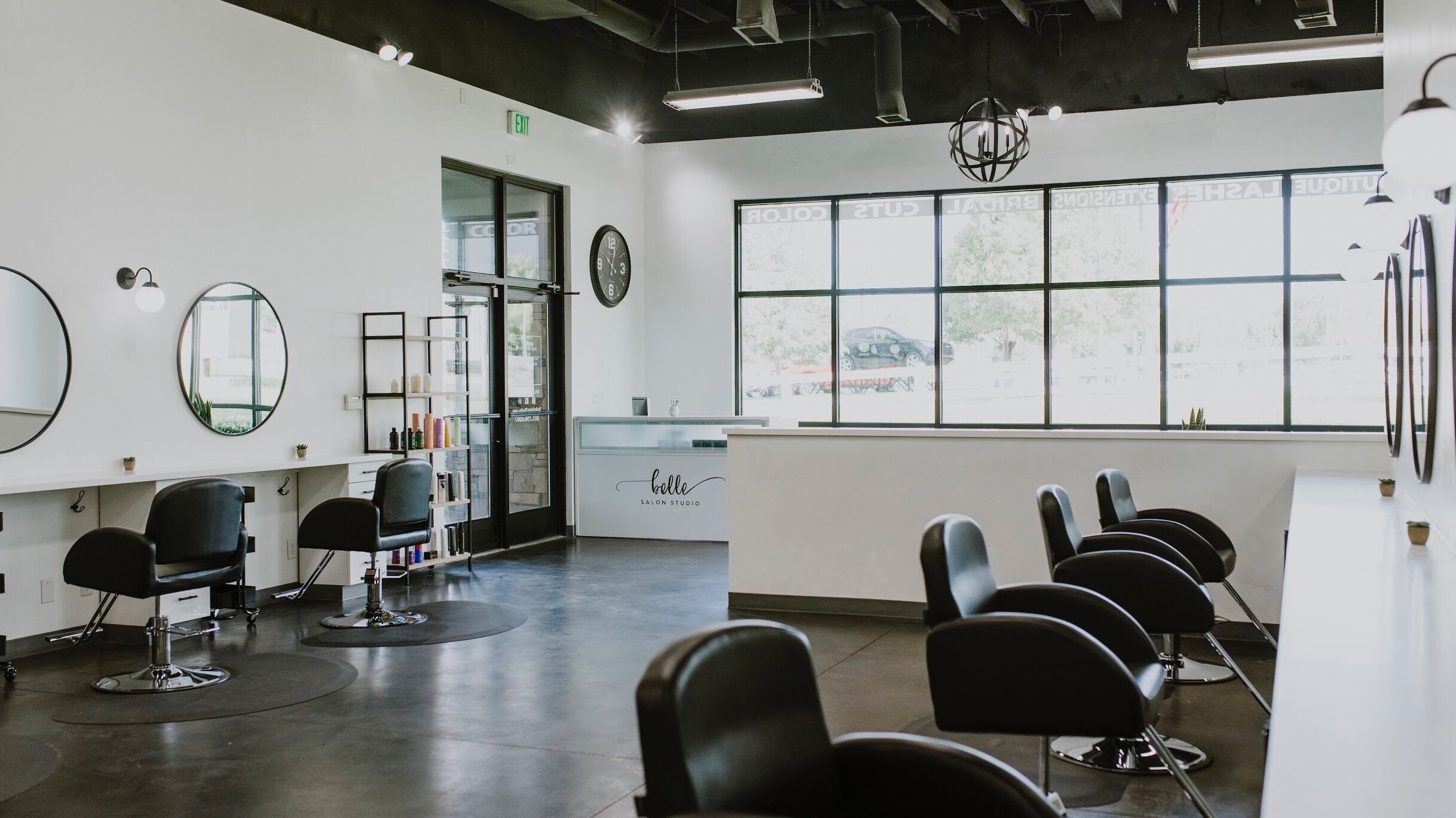 Interior of West Ivie Collective Beauty Lounge in Lindon, Utah, featuring stylish hair stations and mirrors.