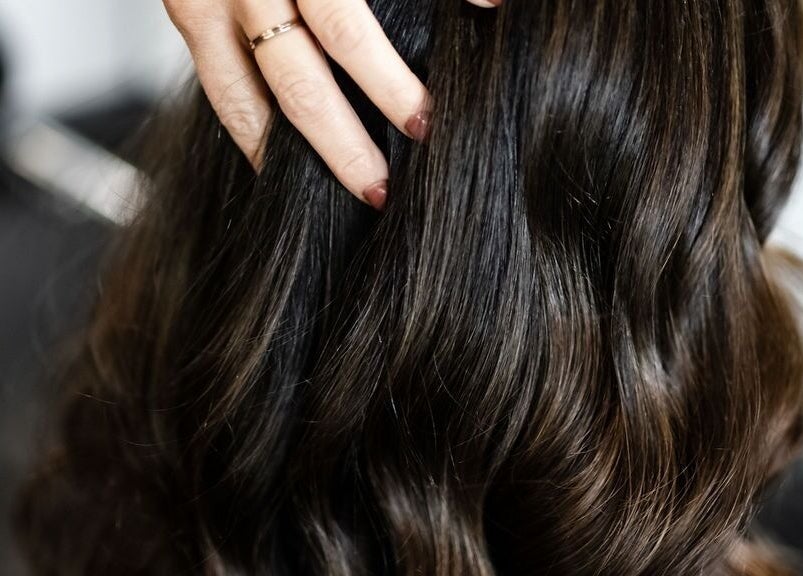 Glossy hair extension styling at West Ivie Collective Beauty Lounge, Lindon, Utah, US.