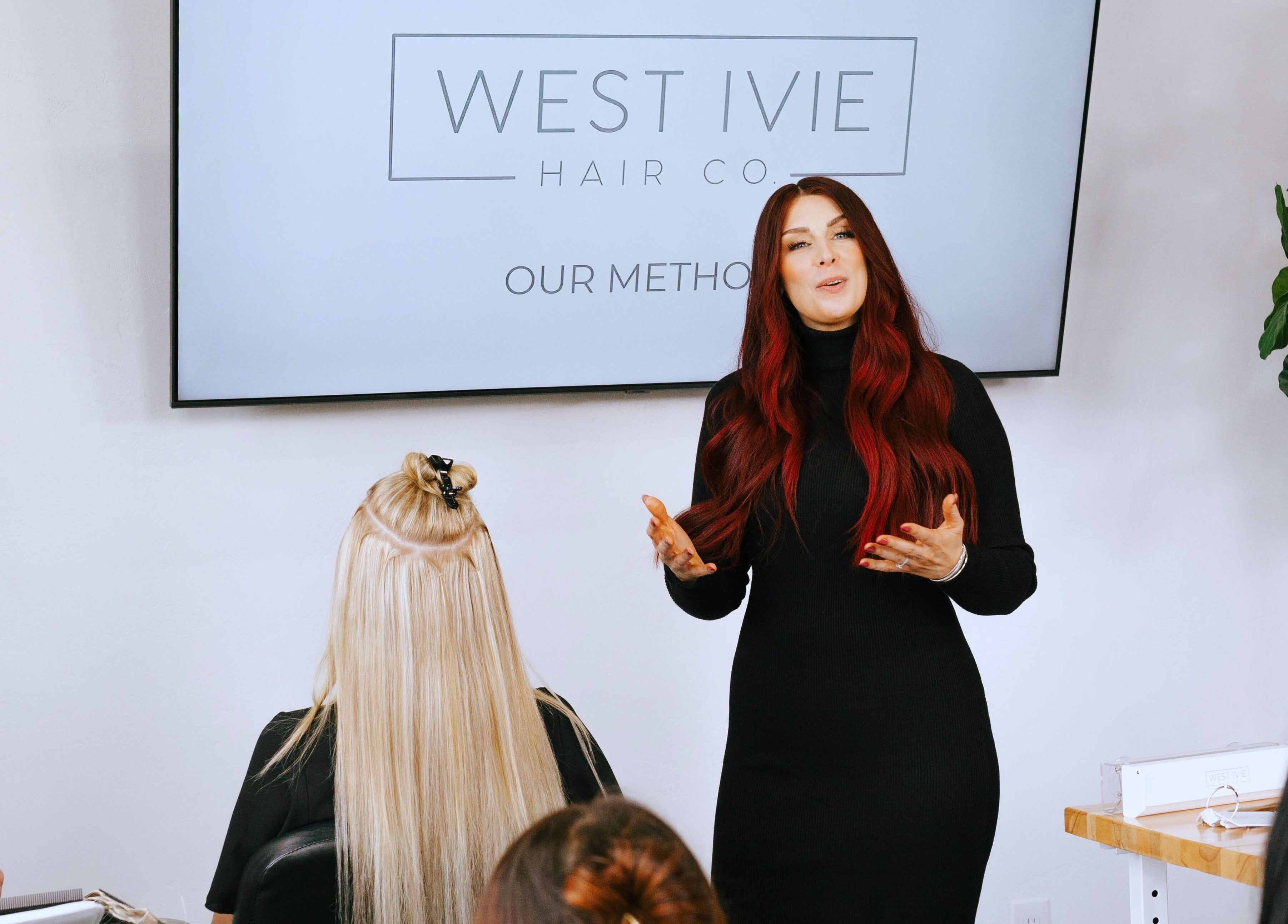 Education session at West Ivie Collective Beauty Lounge, Lindon, Utah, US, showcasing hair extensions techniques.